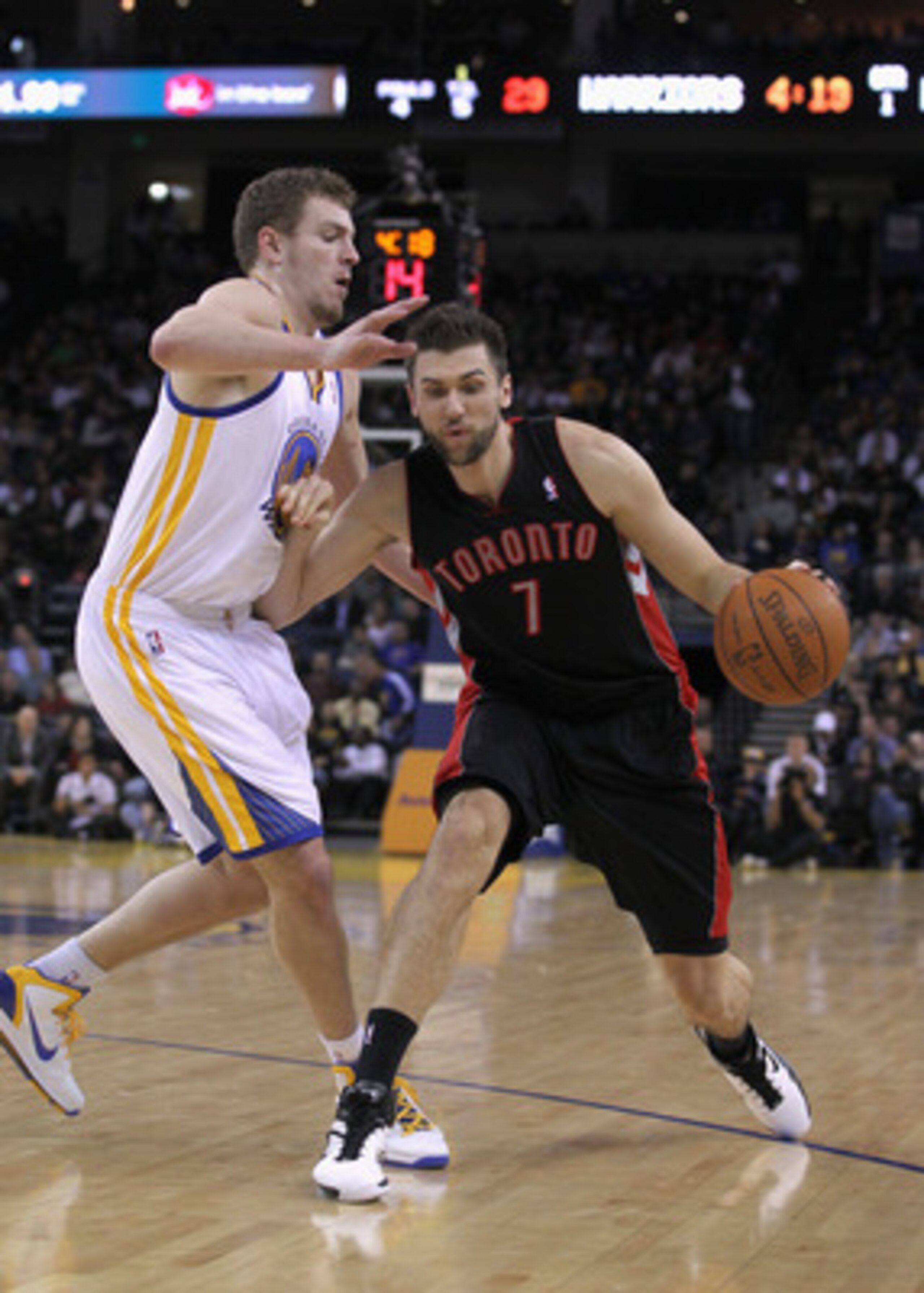 OAKLAND, CA - MARCH 25: Andrea Bargnani #7 of the Toronto Raptors drives on David Lee #10 of the Golden State Warriors at Oracle Arena on March 25, 2011 in Oakland, California. NOTE TO USER: User expressly acknowledges and agrees that, by downloading and OAKLAND, CA - MARCH 25: Andrea Bargnani #7 of the Toronto Raptors drives on David Lee #10 of the Golden State Warriors at Oracle Arena on March 25, 2011 in Oakland, California. NOTE TO USER: User expressly acknowledges and agrees that, by downloading and