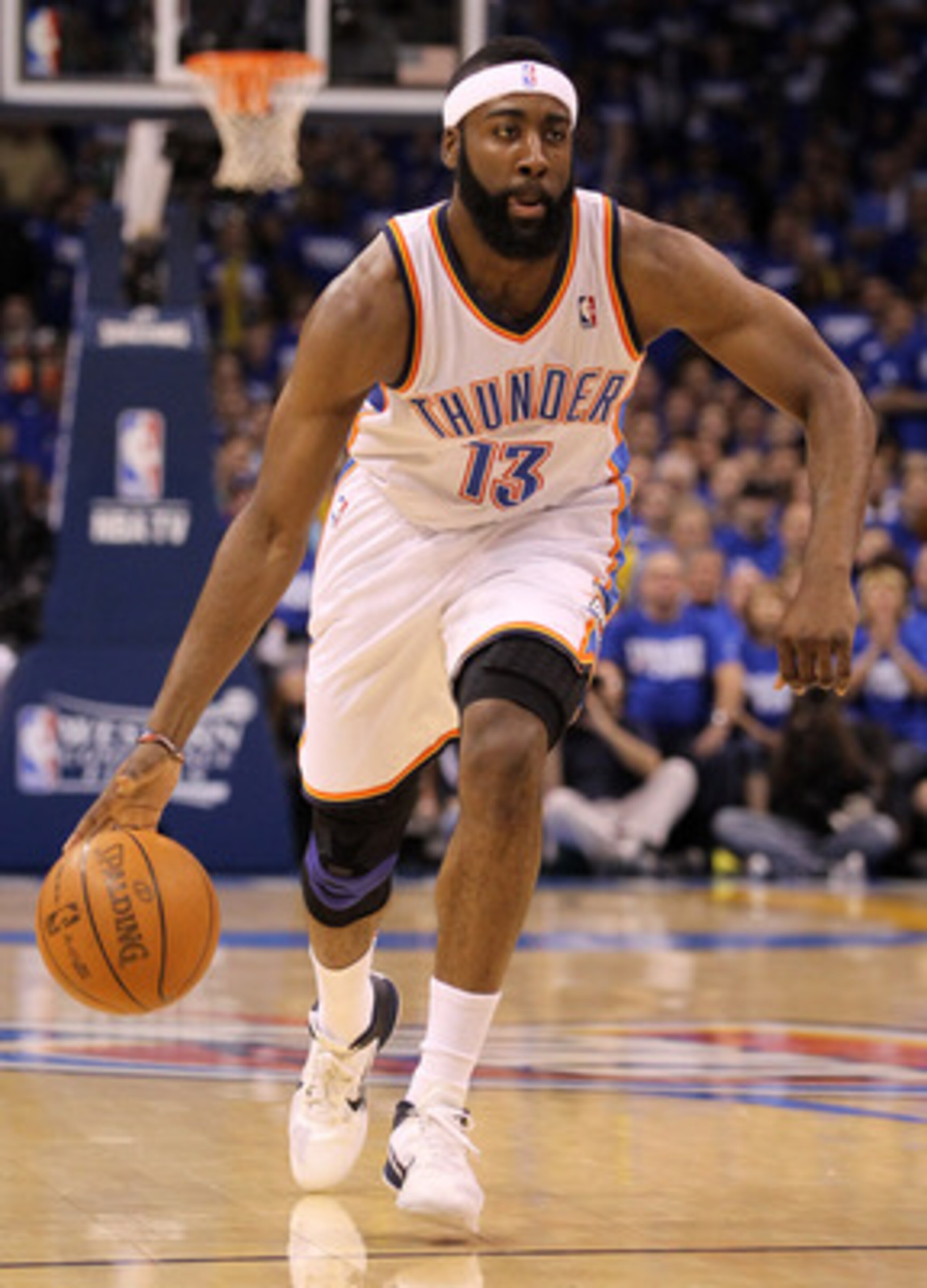 OKLAHOMA CITY, OK - MAY 21:  James Harden #13 of the Oklahoma City Thunder moves the ball while taking on the Dallas Mavericks in Game Three of the Western Conference Finals during the 2011 NBA Playoffs at Oklahoma City Arena on May 21, 2011 in Oklahoma C
