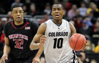 KANSAS CITY, MO - MARCH 10:  Alec Burks #10 of the Colorado Buffaloes moves the ball against Mike Singletary #32 of  the Texas Tech Red Raiders in the first half during the first round game of the 2010 Phillips 66 Big 12 Men's Basketball Tournament at the