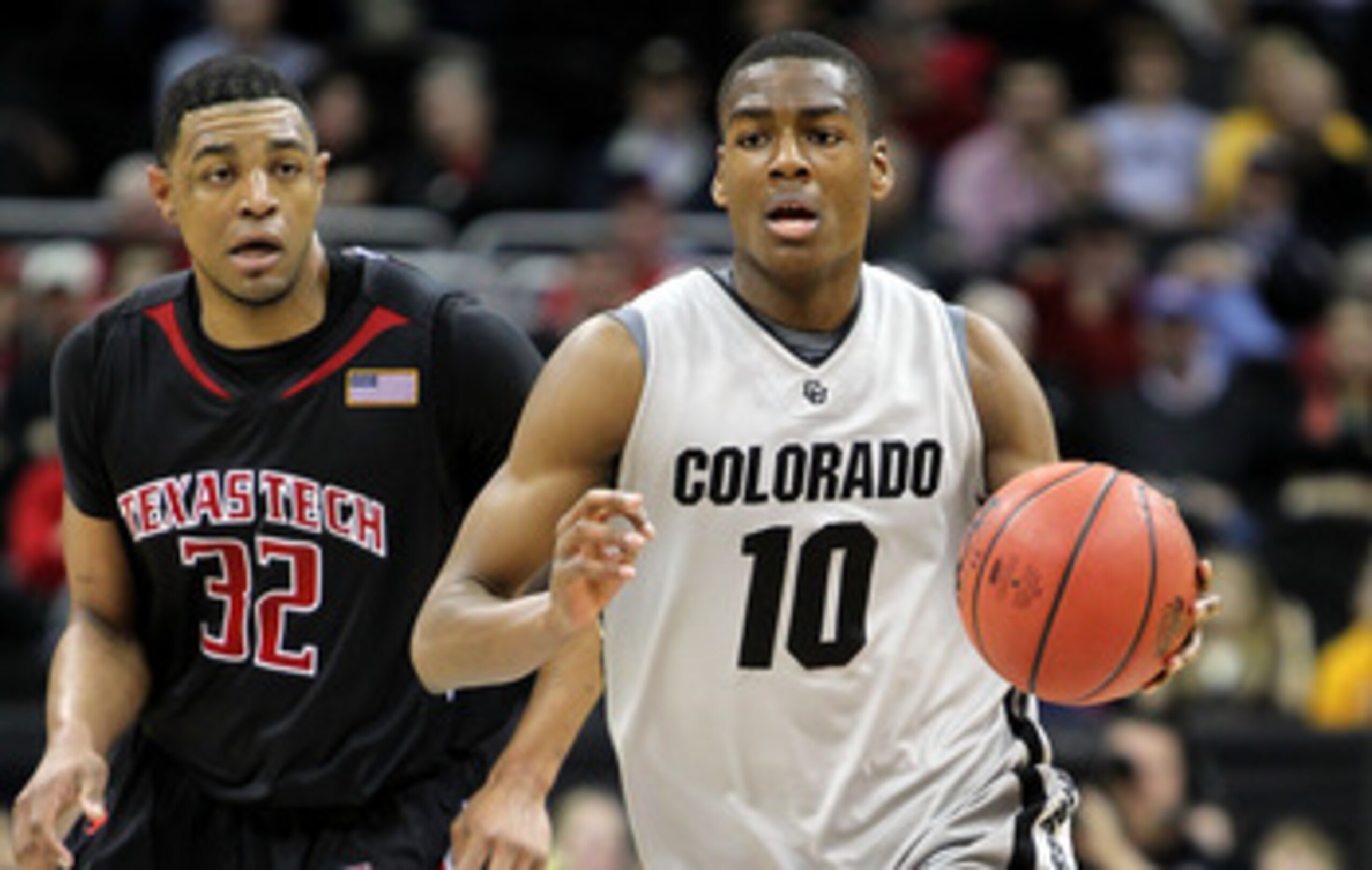 KANSAS CITY, MO - MARCH 10:  Alec Burks #10 of the Colorado Buffaloes moves the ball against Mike Singletary #32 of  the Texas Tech Red Raiders in the first half during the first round game of the 2010 Phillips 66 Big 12 Men's Basketball Tournament at the
