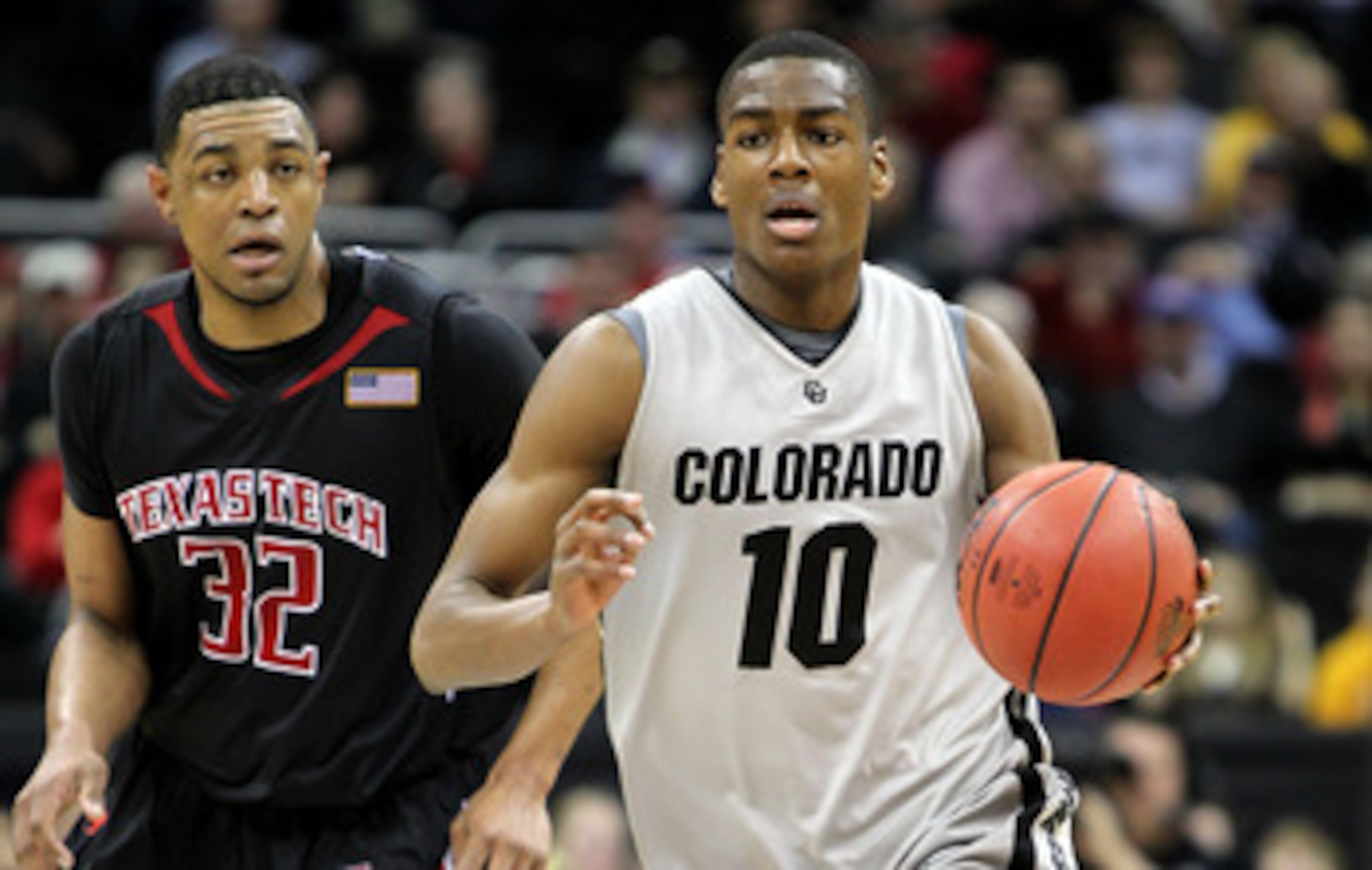 KANSAS CITY, MO - MARCH 10:  Alec Burks #10 of the Colorado Buffaloes moves the ball against Mike Singletary #32 of  the Texas Tech Red Raiders in the first half during the first round game of the 2010 Phillips 66 Big 12 Men's Basketball Tournament at the