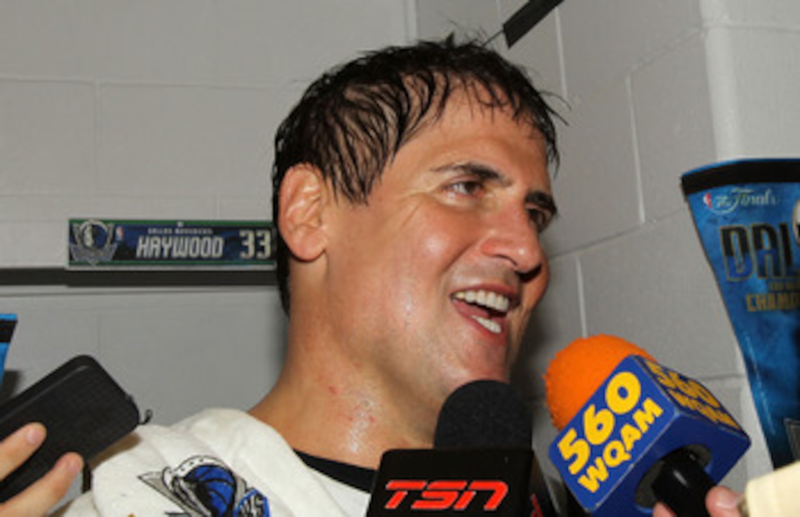 MIAMI, FL - JUNE 12:  Team owner Mark Cuban of the Dallas Mavericks is interviewed in the locker room after the Mavericks won 105-95 againstv the Miami Heat in Game Six of the 2011 NBA Finals at American Airlines Arena on June 12, 2011 in Miami, Florida.
