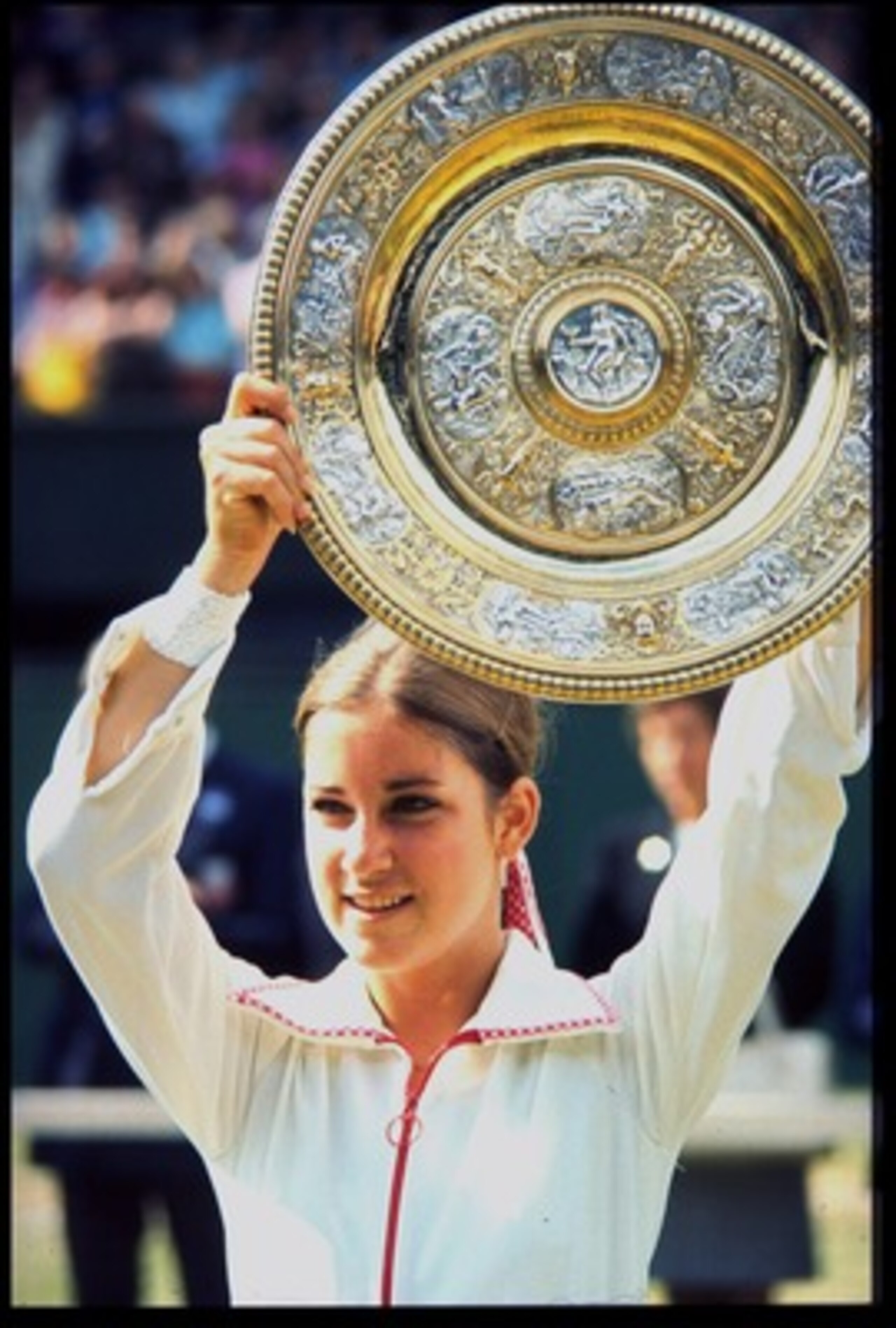 JUL 1974:  CHRIS EVERT OF THE UNITED STATES HOLDS THE LADIES SINGLES PLATE ALOFT AFTER WINNING ON THE CENTRE COURT AT WIMBLEDON.