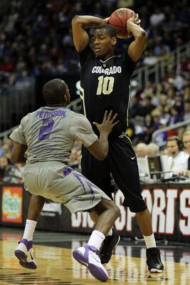 KANSAS CITY, MO - MARCH 10:  Alec Burks #10 of the Colorado Buffaloes looks to move the ball as Devon Peterson #2 of the Kansas State Wildcats defends during their quarterfinal game in the 2011 Phillips 66 Big 12 Men's Basketball Tournament at Sprint Cent