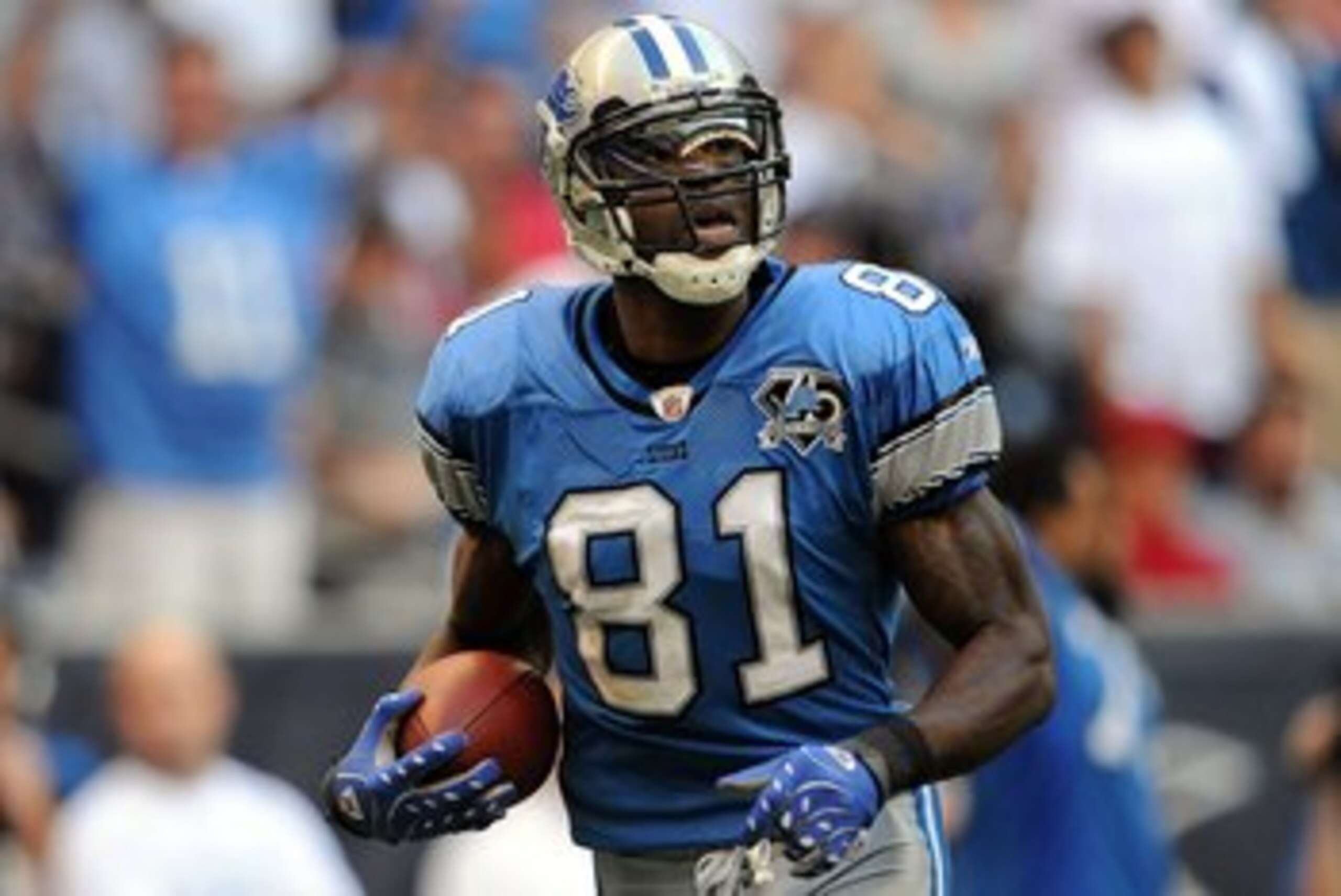 HOUSTON - OCTOBER 19:  Wide receiver Calvin Johnson #81 of the Detroit Lions makes a touchdown pass reception against the Houston Texans at Reliant Stadium on October 19, 2008 in Houston, Texas.  (Photo by Ronald Martinez/Getty Images)