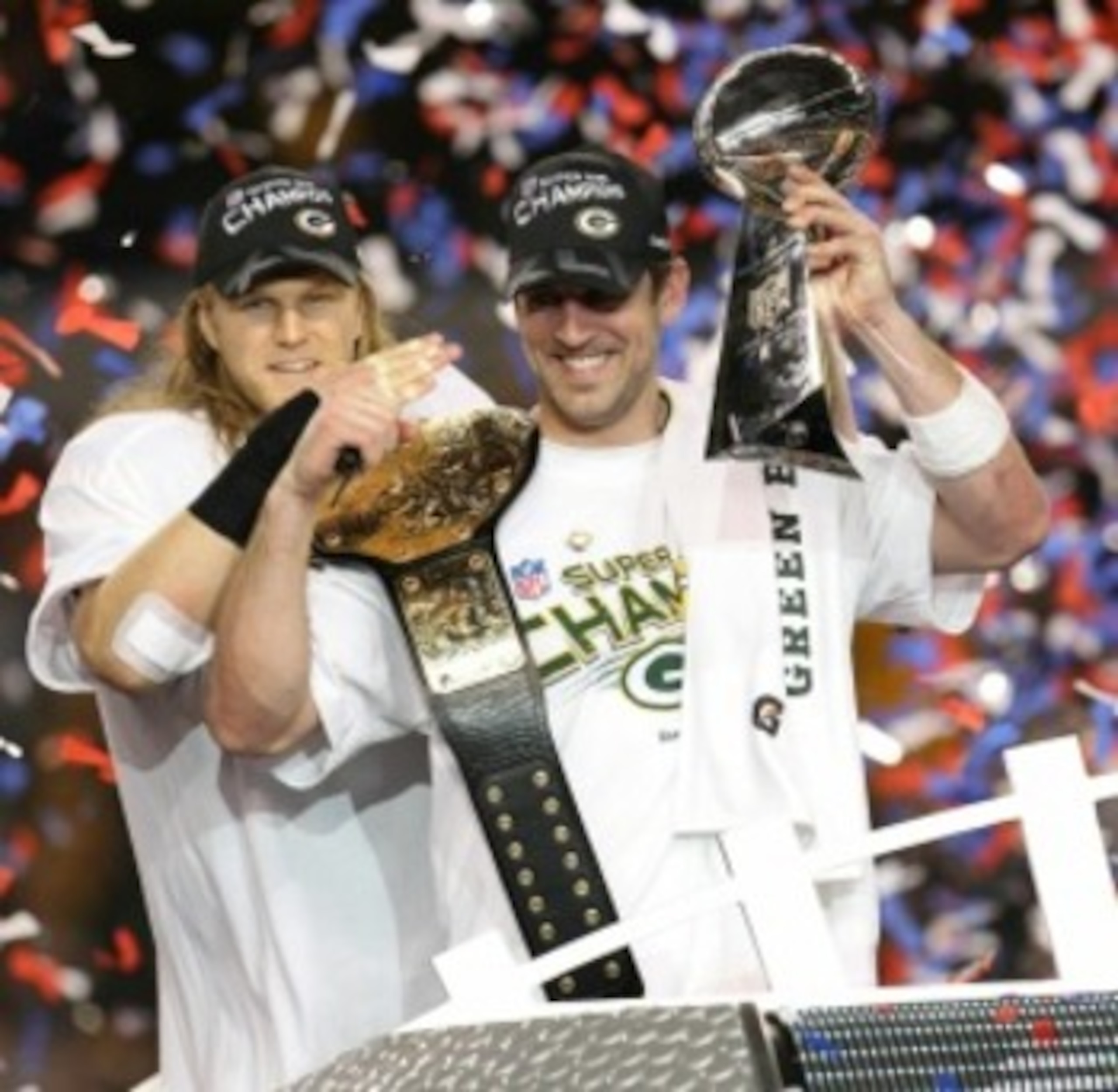 ARLINGTON, TX - FEBRUARY 06:  Aaron Rodgers #12 and Clay Matthews #52 of the Green Bay Packers of the Green Bay Packers holds the Lombardi Trophy after defeating the Pittsburgh Steelers 31-25 during Super Bowl XLV at Cowboys Stadium on February 6, 2011 in