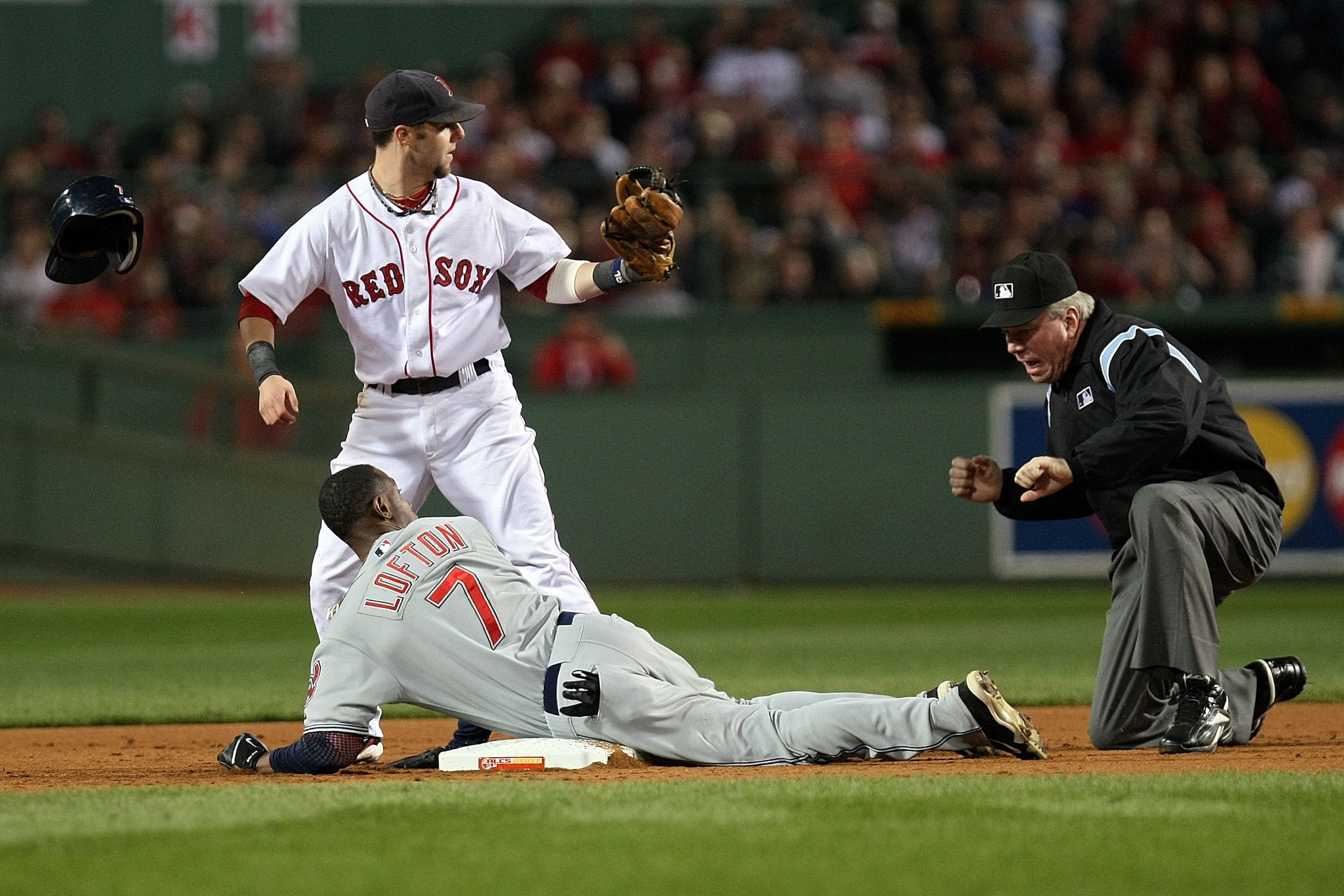BOSTON - OCTOBER 21: Kenny Lofton #7 of the Cleveland Indians and Dustin Pedroia #15 of the Boston Red Sox look to second base umpire Brian Gorman as he calls Lofton out at second in the fifth inning of Game Seven of the American League Championship Seri BOSTON - OCTOBER 21: Kenny Lofton #7 of the Cleveland Indians and Dustin Pedroia #15 of the Boston Red Sox look to second base umpire Brian Gorman as he calls Lofton out at second in the fifth inning of Game Seven of the American League Championship Seri