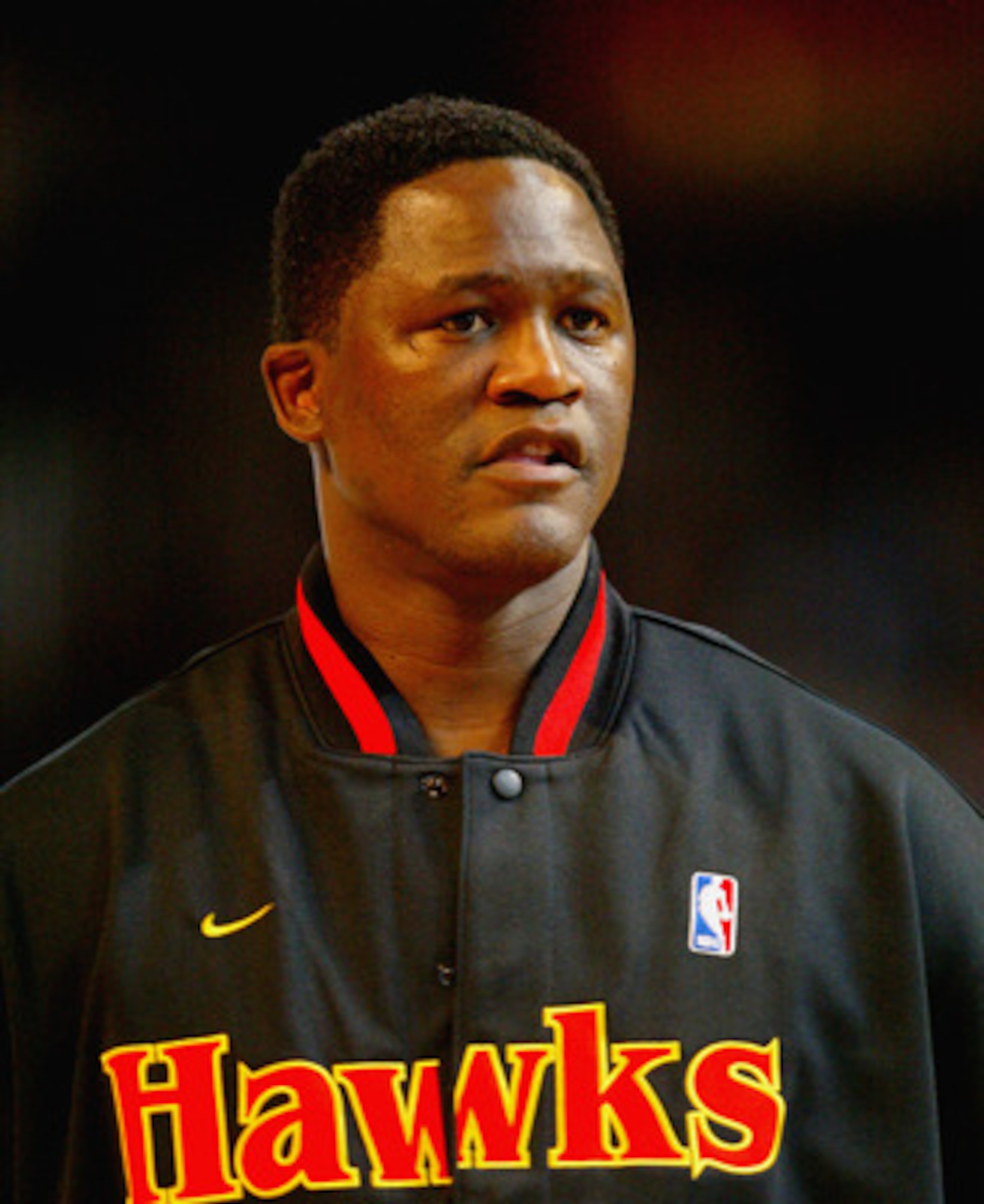 ATLANTA - FEBRUARY 8:  Dominique Wilkins of the Atlanta Team looks on before the Jeep Hoop it Up Game during the 2003 NBA All Star weekend at Philips Arena on February 8, 2003 in Atlanta, Georgia.  NOTE TO USER: User expressly acknowledges and agrees that