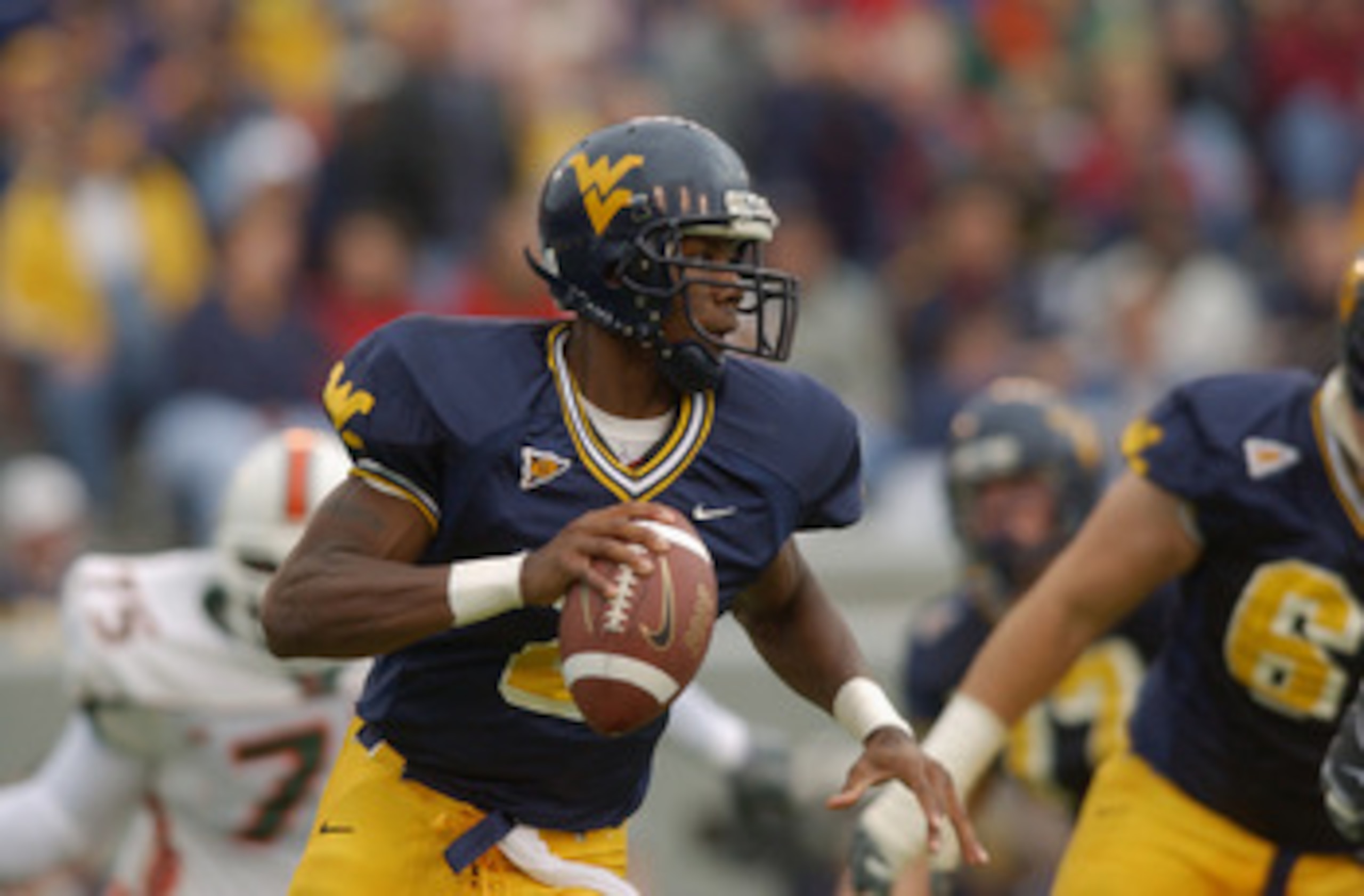 MORGANTOWN, WV - OCTOBER 26:  WVU quarterback Rasheed Marshall #2 looks for a reciever during the NCAA football game against the Miami Hurricanes at Mountaineer Field in Morgantown, West Virginia on October 26, 2002.  The University of Miami (Florida) Hur