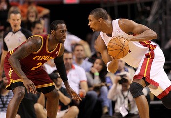 MIAMI, FL - JANUARY 31:  Chris Bosh #1 of the Miami Heat posts up  J.J. Hickson #21 of the Cleveland Cavaliers during a game at American Airlines Arena on January 31, 2011 in Miami, Florida. NOTE TO USER: User expressly acknowledges and agrees that, by do