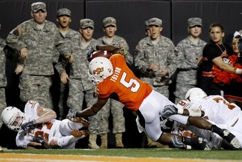 STILLWATER, OK - OCTOBER 31: Running back Keith Toston #5 of the Oklahoma State Cowboys completes a pass to the one yard line during the second quarter of the game against the Texas Longhorns at Boone Pickens Stadium on October 31, 2009 in Stillwater, Ok STILLWATER, OK - OCTOBER 31: Running back Keith Toston #5 of the Oklahoma State Cowboys completes a pass to the one yard line during the second quarter of the game against the Texas Longhorns at Boone Pickens Stadium on October 31, 2009 in Stillwater, Ok