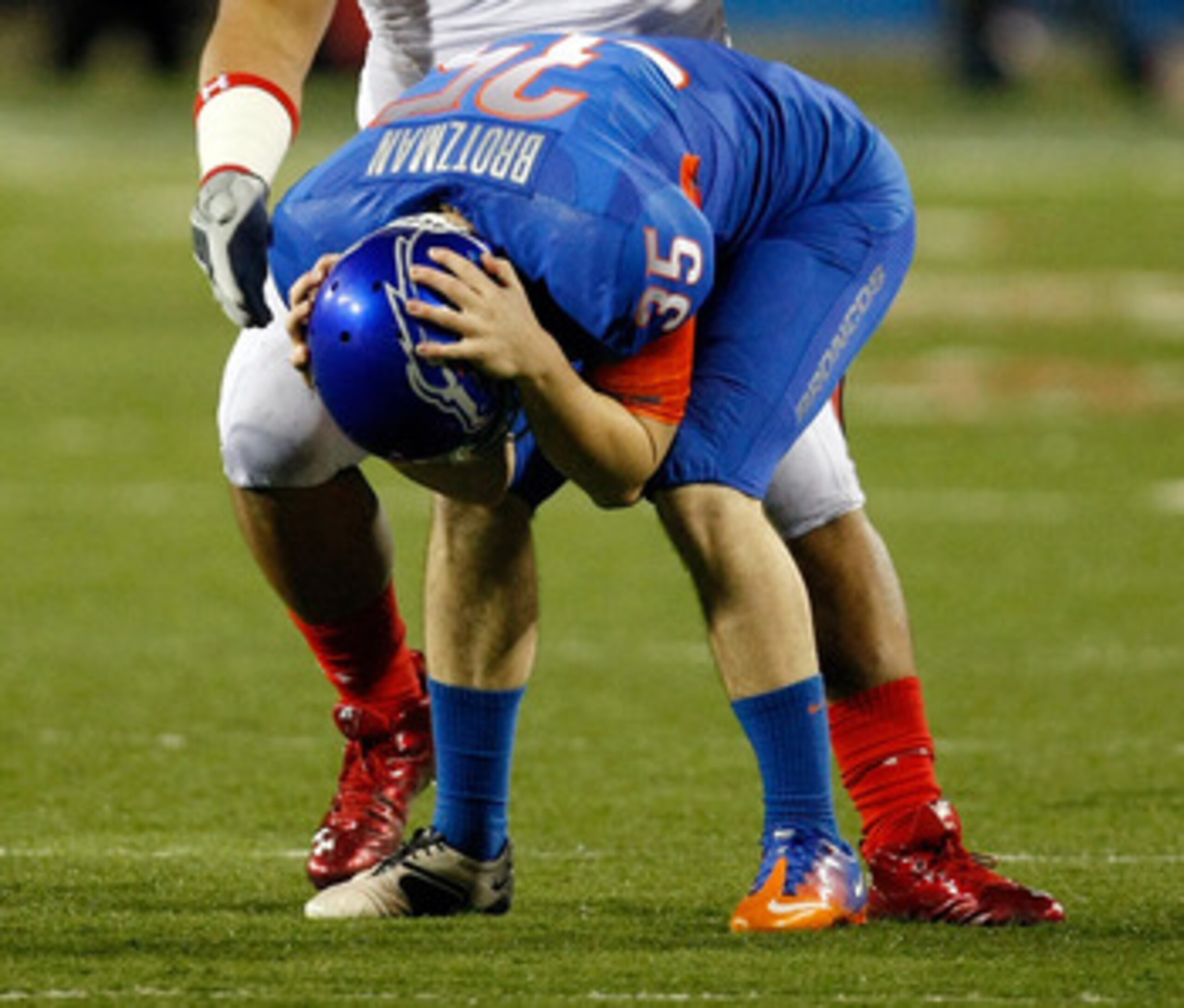 LAS VEGAS, NV - DECEMBER 22:  Kyle Brotzman #35 of the Boise State Broncos reacts in front of Sealver Siliga #98 of the Utah Utes after Brotzman dropped a pass intended for him on a fake punt during the MAACO Bowl Las Vegas at Sam Boyd Stadium December 22