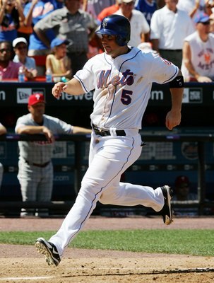 NEW YORK - AUGUST 05:  David Wright #5 of the New York Mets scores his teams fourth run against the Philadelphia Phillies in the sixth inning on August 5, 2006 at Shea Stadium in the Flushing neighborhood of the Queens borough of New York City. The Mets d