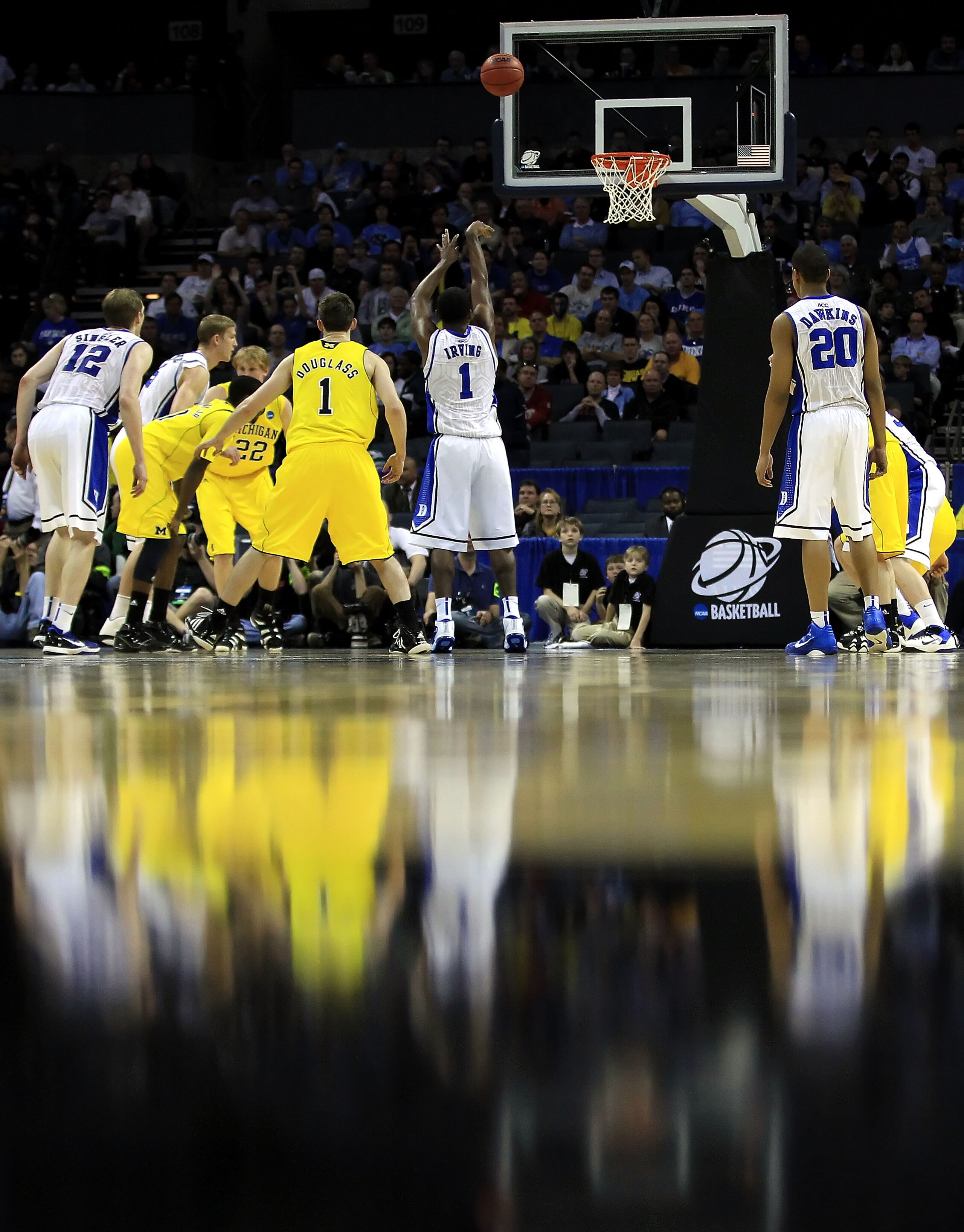 CHARLOTTE, NC - MARCH 20:  Kyrie Irving #1 of the Duke Blue Devils shoots a free throw while taking on the Michigan Wolverines during the third round of the 2011 NCAA men's basketball tournament at Time Warner Cable Arena on March 20, 2011 in Charlotte, N