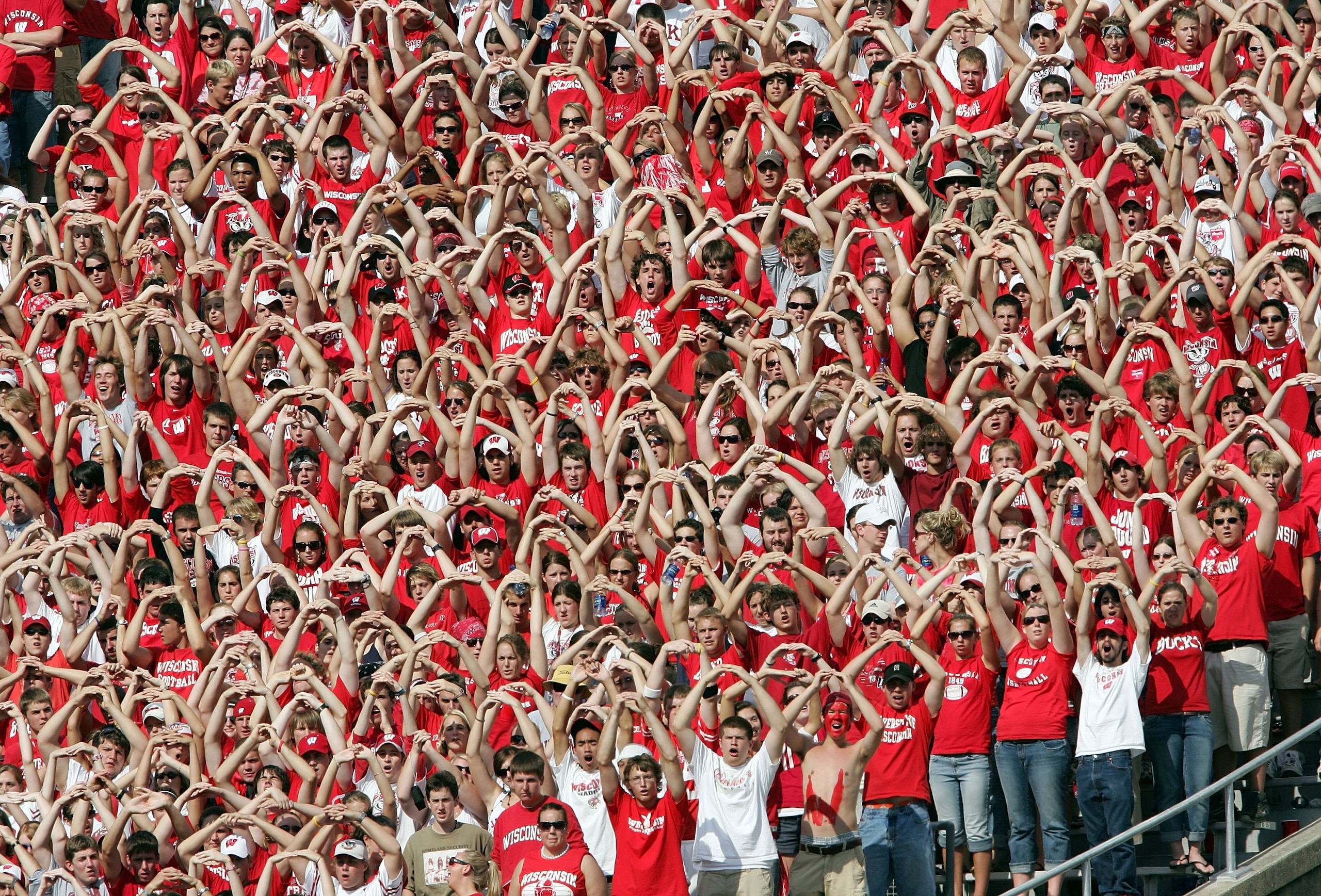 MADISON, WI - SEPTEMBER 16:  The Wisconsin Badgers student section helps their team during the opening kickoff against the San Diego State Aztecs on September 16, 2006 at Camp Randall Stadium in Madison, Wisconsin.  (Photo by Elsa/Getty Images)