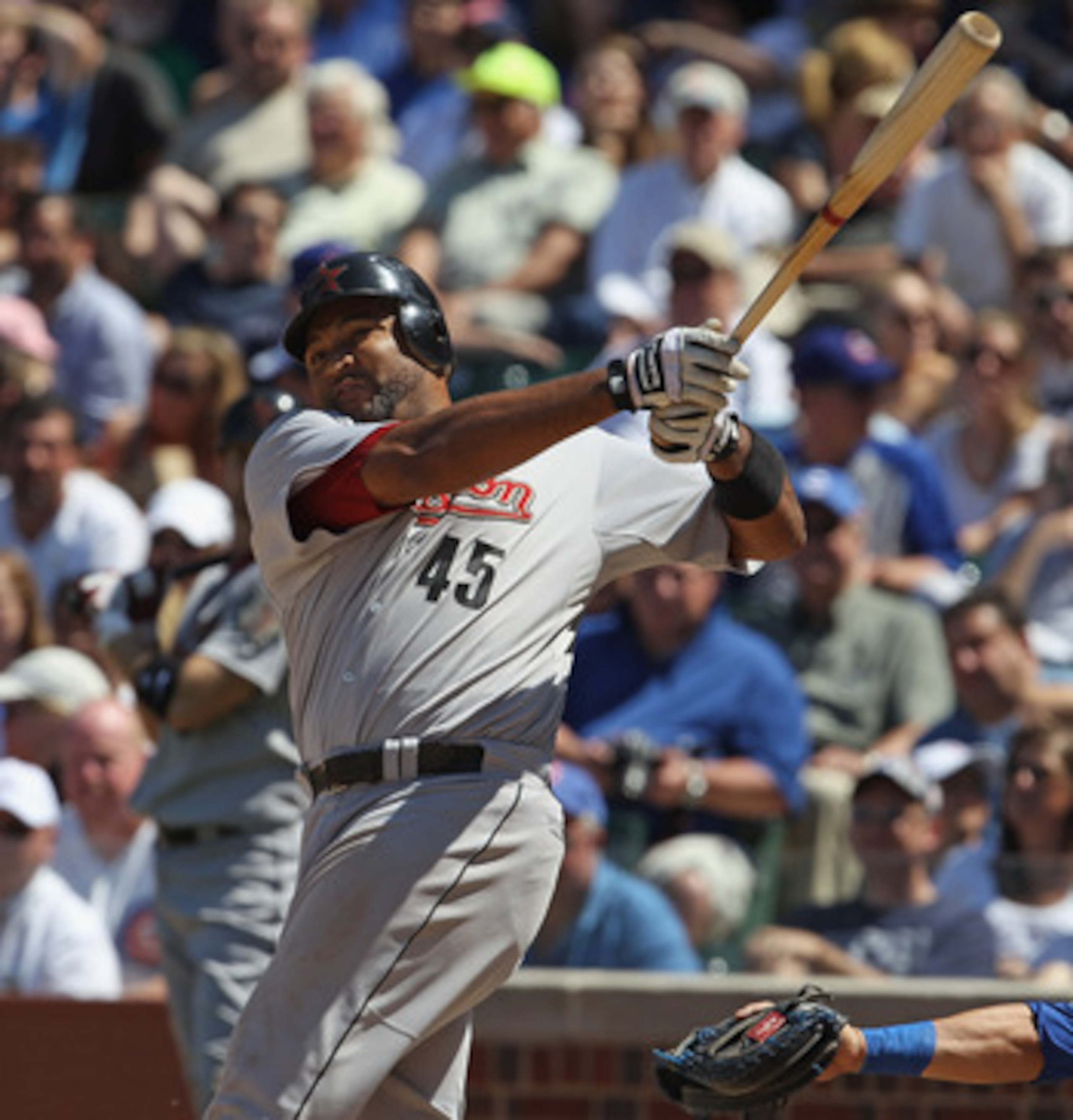CHICAGO, IL - JUNE 01:  Carlos Lee #45 of the Houston Astros takes a swing against the Chicago Cubs at Wrigley Field on June 1, 2011 in Chicago, Illinois. The Astros defeated the Cubs 3-1.  (Photo by Jonathan Daniel/Getty Images)