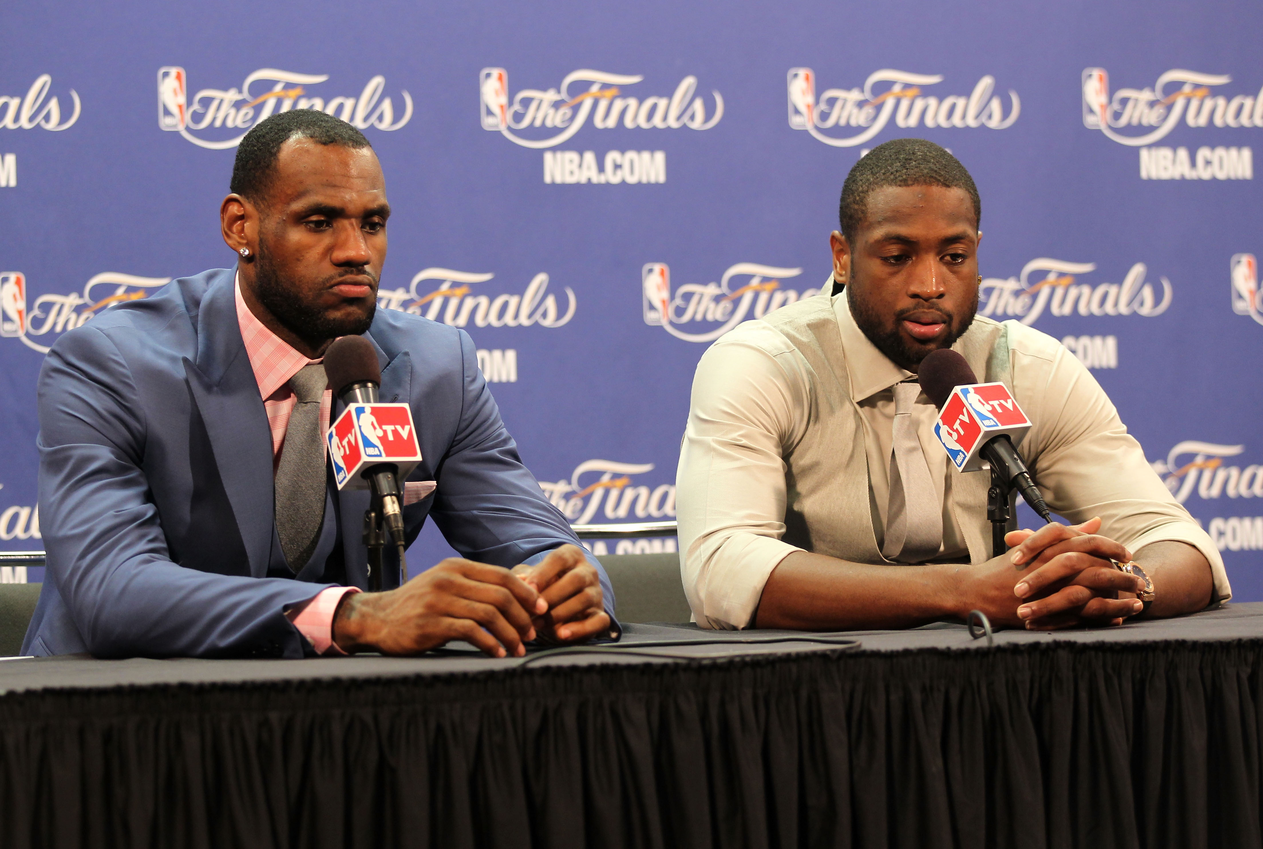 MIAMI, FL - JUNE 12:  LeBron James #6 and Dwyane Wade #3 of the Miami Heat answer questions after the Heat were defeated 105-95 by the Dallas Mavericks in Game Six of the 2011 NBA Finals at American Airlines Arena on June 12, 2011 in Miami, Florida. NOTE