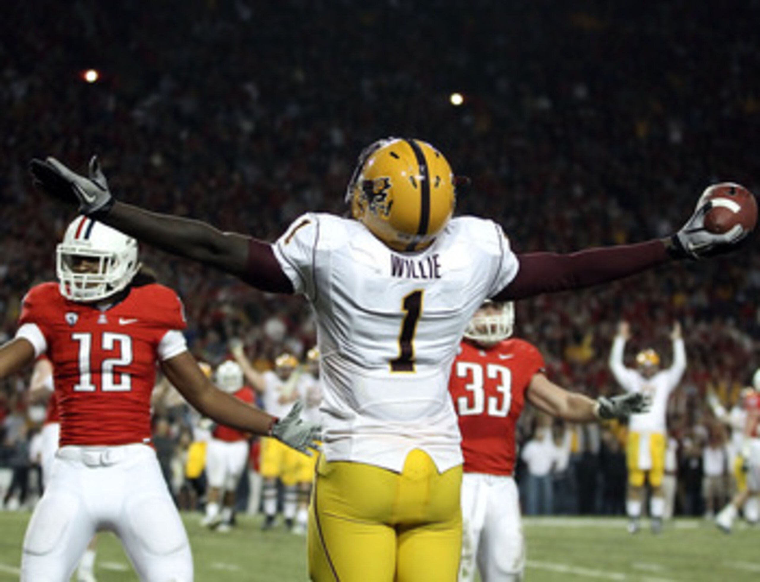 TUCSON, AZ - DECEMBER 02:  Wide receiver Mike Willie #1 of the Arizona State Sun Devils celebrates after scoring a touchdown reception during the college football game at Arizona Stadium on December 2, 2010 in Tucson, Arizona. The Sun Devils defeated the