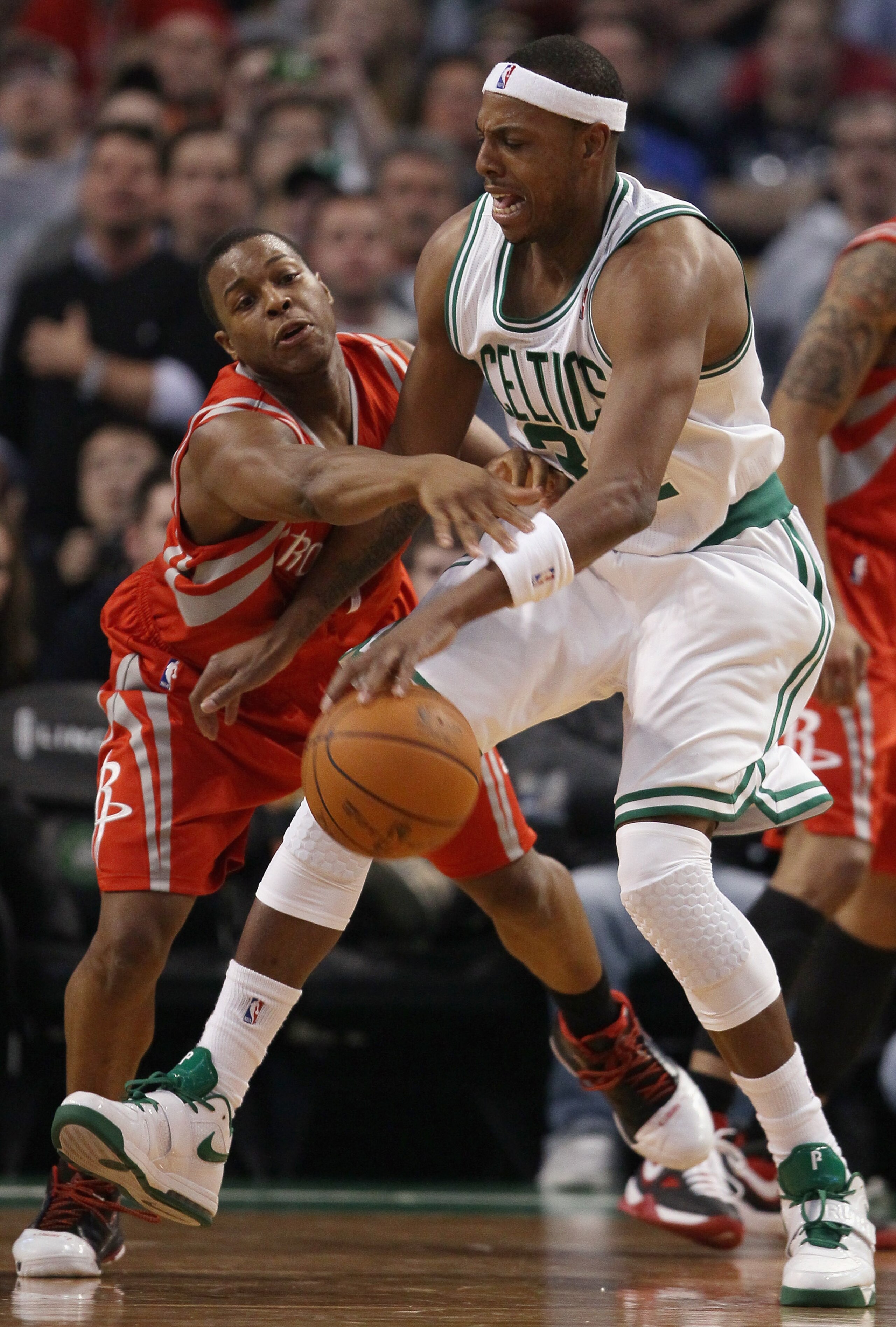 BOSTON, MA - JANUARY 10: Paul Pierce #34 of the Boston Celtics tries to get around Kyle Lowry #7 of the Houston Rockets on January 10, 2011 at the TD Garden in Boston, Massachusetts. The Rockets defeated the Celtics 108-102. NOTE TO USER: User expressly BOSTON, MA - JANUARY 10: Paul Pierce #34 of the Boston Celtics tries to get around Kyle Lowry #7 of the Houston Rockets on January 10, 2011 at the TD Garden in Boston, Massachusetts. The Rockets defeated the Celtics 108-102. NOTE TO USER: User expressly