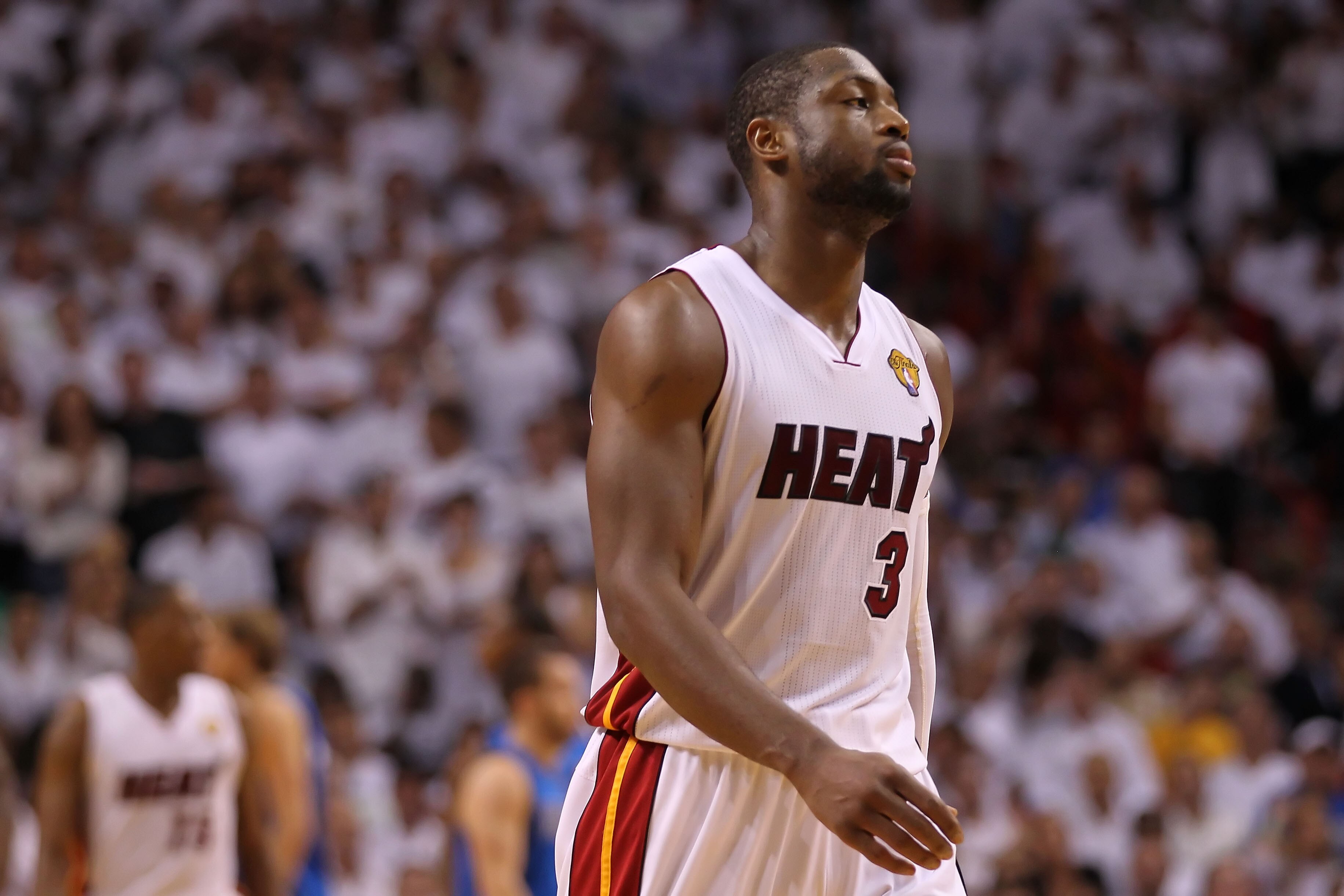 MIAMI, FL - JUNE 12:  Dwyane Wade #3 of the Miami Heat walks upp court against the Dallas Mavericks in Game Six of the 2011 NBA Finals at American Airlines Arena on June 12, 2011 in Miami, Florida. NOTE TO USER: User expressly acknowledges and agrees that