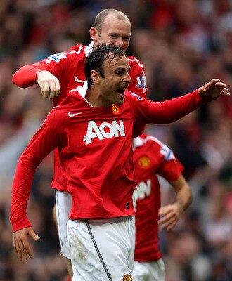 MANCHESTER, ENGLAND - SEPTEMBER 19:  Dimitar Berbatov of Manchester United celebrates scoring his team's second goal with team mate Wayne Rooney during the Barclays Premier League match between Manchester United and Liverpool at Old Trafford on September 