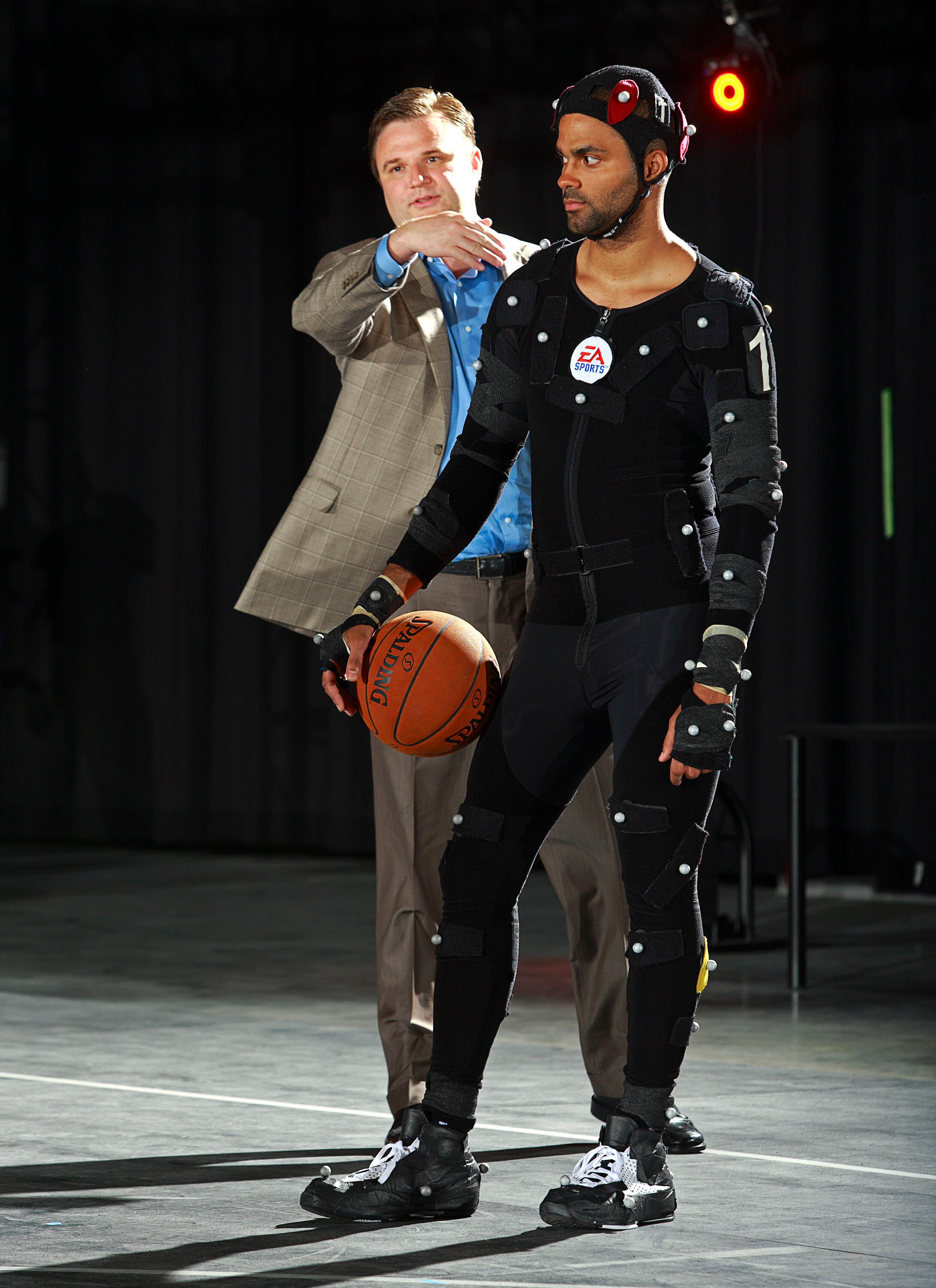 BURNABY, CANADA - JULY 29: In this photo provided by Electronic Arts, Houston Rockets General Manager Daryl Morey (L) instructs Tony Parker of the San Antonio Spurs during a motion capture session at the Electronic Arts studios July 29, 2008 in Burnaby, B