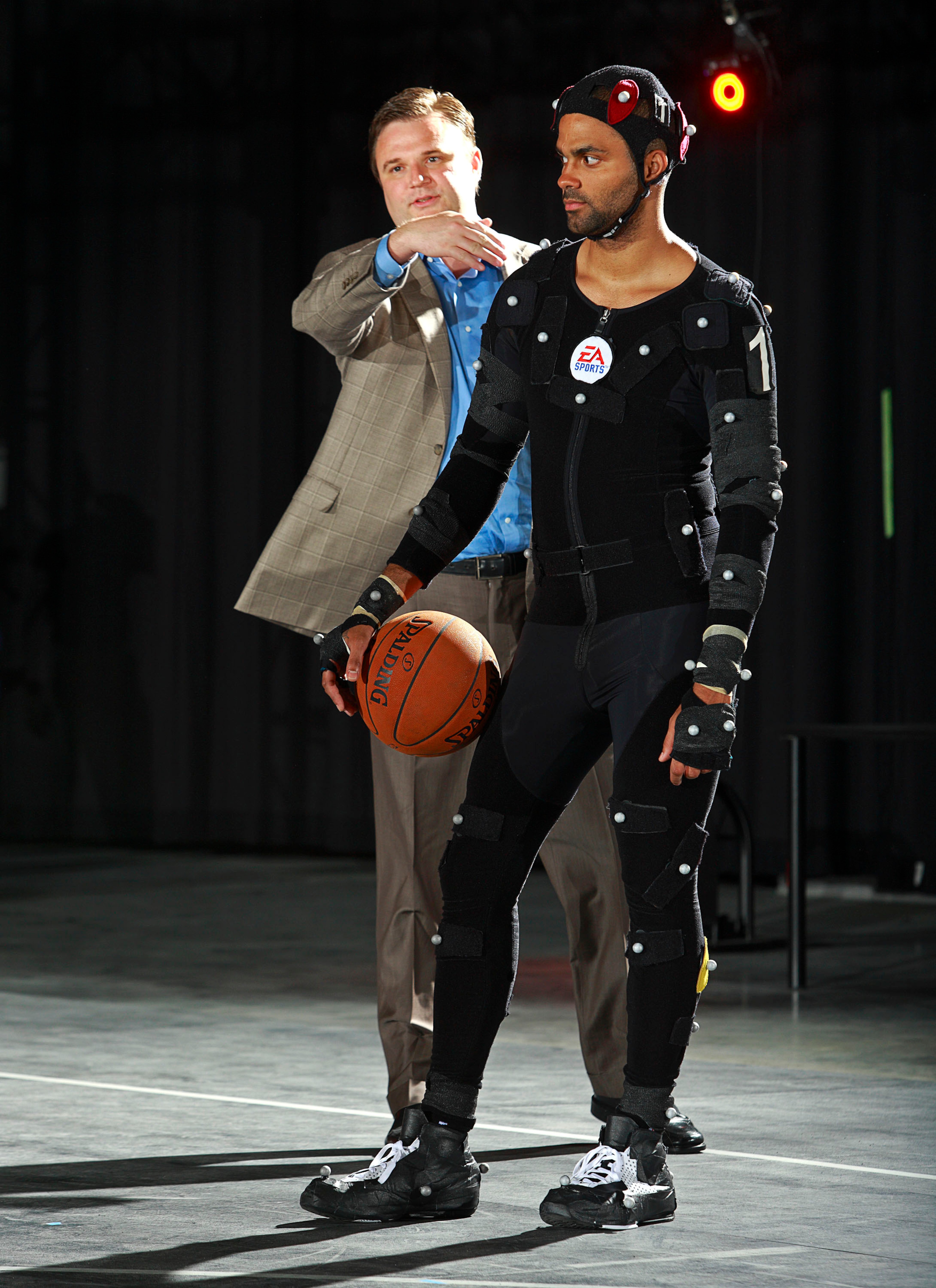BURNABY, CANADA - JULY 29: In this photo provided by Electronic Arts, Houston Rockets General Manager Daryl Morey (L) instructs Tony Parker of the San Antonio Spurs during a motion capture session at the Electronic Arts studios July 29, 2008 in Burnaby, B