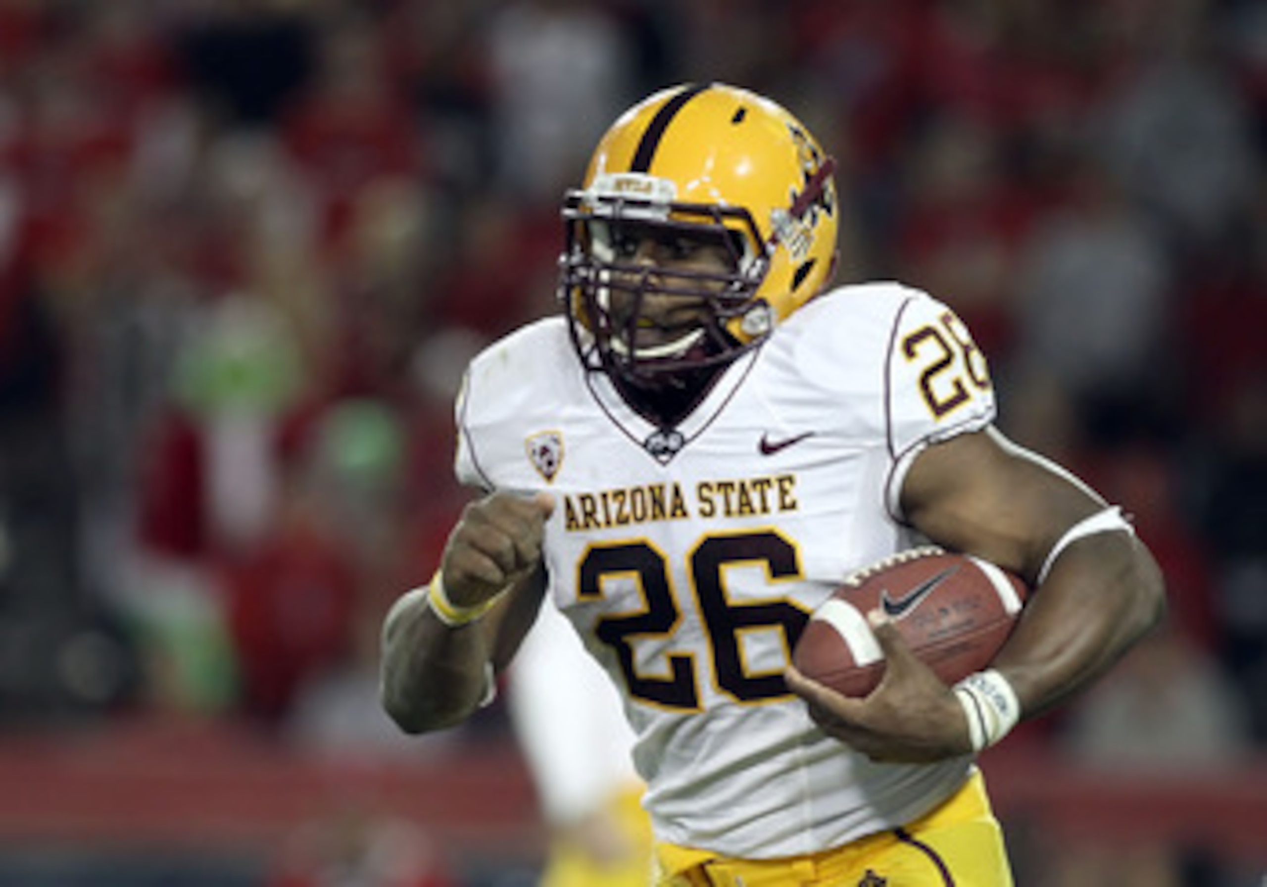 TUCSON, AZ - DECEMBER 02:  Runningback Cameron Marshall #26 of the Arizona State Sun Devils runs with the football during the college football game at Arizona Stadium on December 2, 2010 in Tucson, Arizona. The Sun Devils defeated the Wildcats 30-29 in do