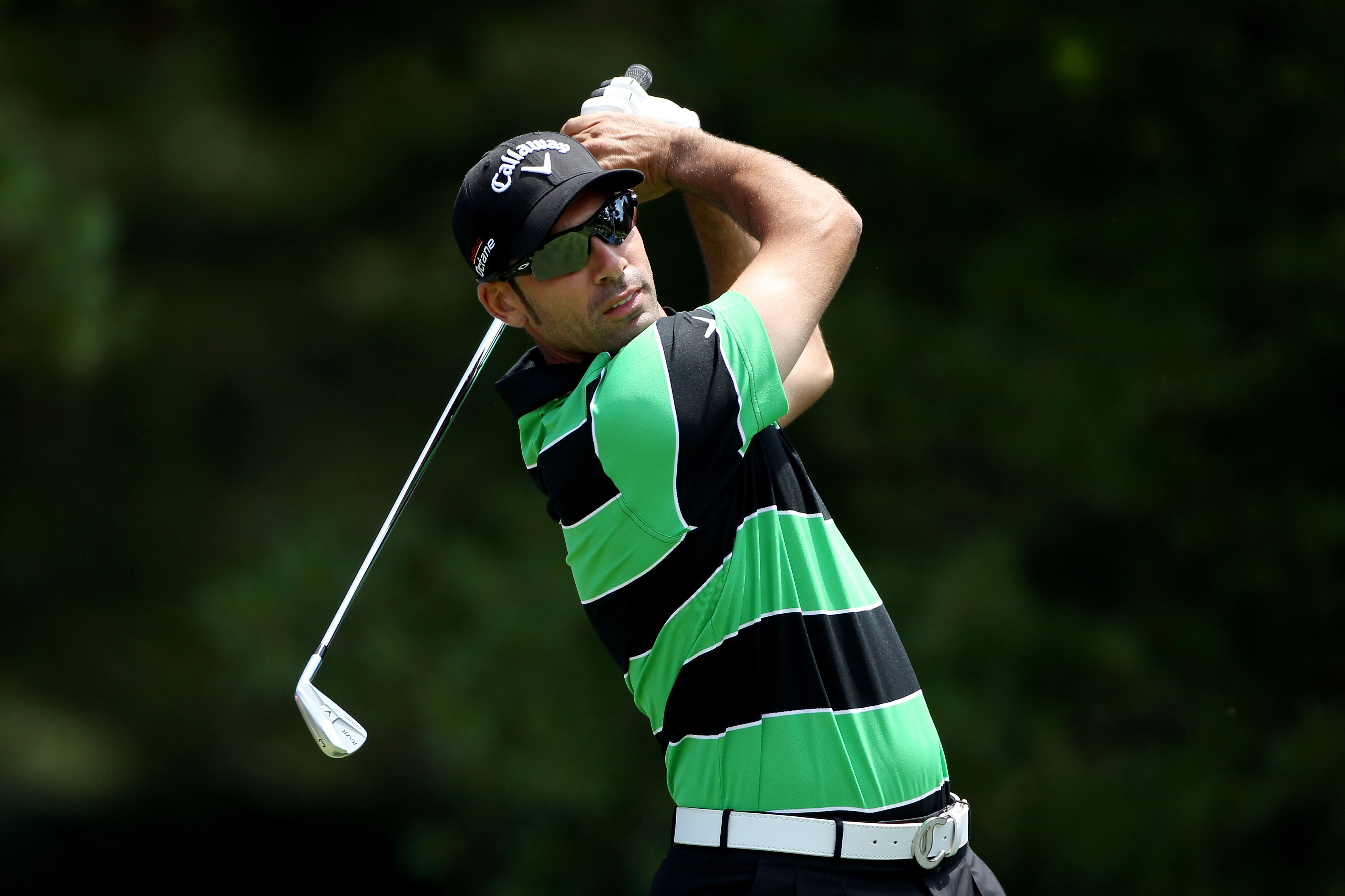 BETHESDA, MD - JUNE 13:   Alvaro Quiros of Spain watches a shot during a practice round prior to the start of the 111th U.S. Open at Congressional Country Club on June 13, 2011 in Bethesda, Maryland.  (Photo by Andrew Redington/Getty Images)