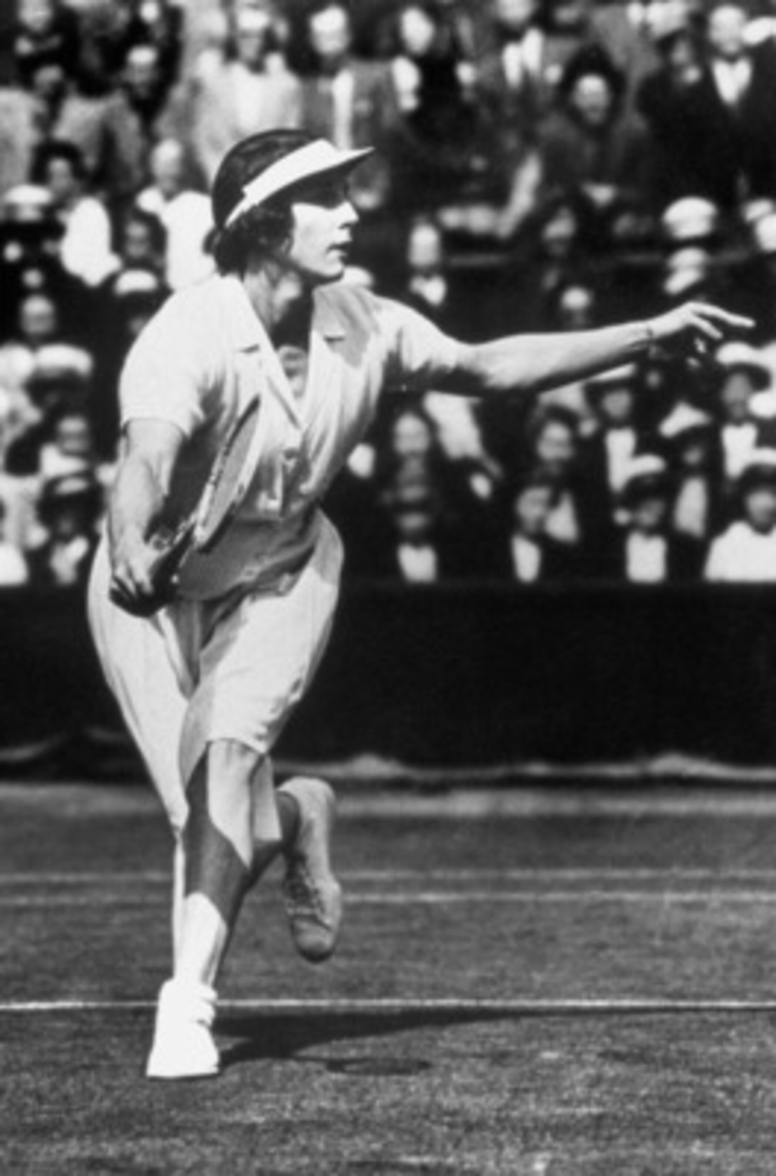1924: Helen Wills Moody runs to the ball during a match circa 1924  in Paris, France. Helen Wills Moody wins the gold for womens singles event. (Photo by Getty Images)