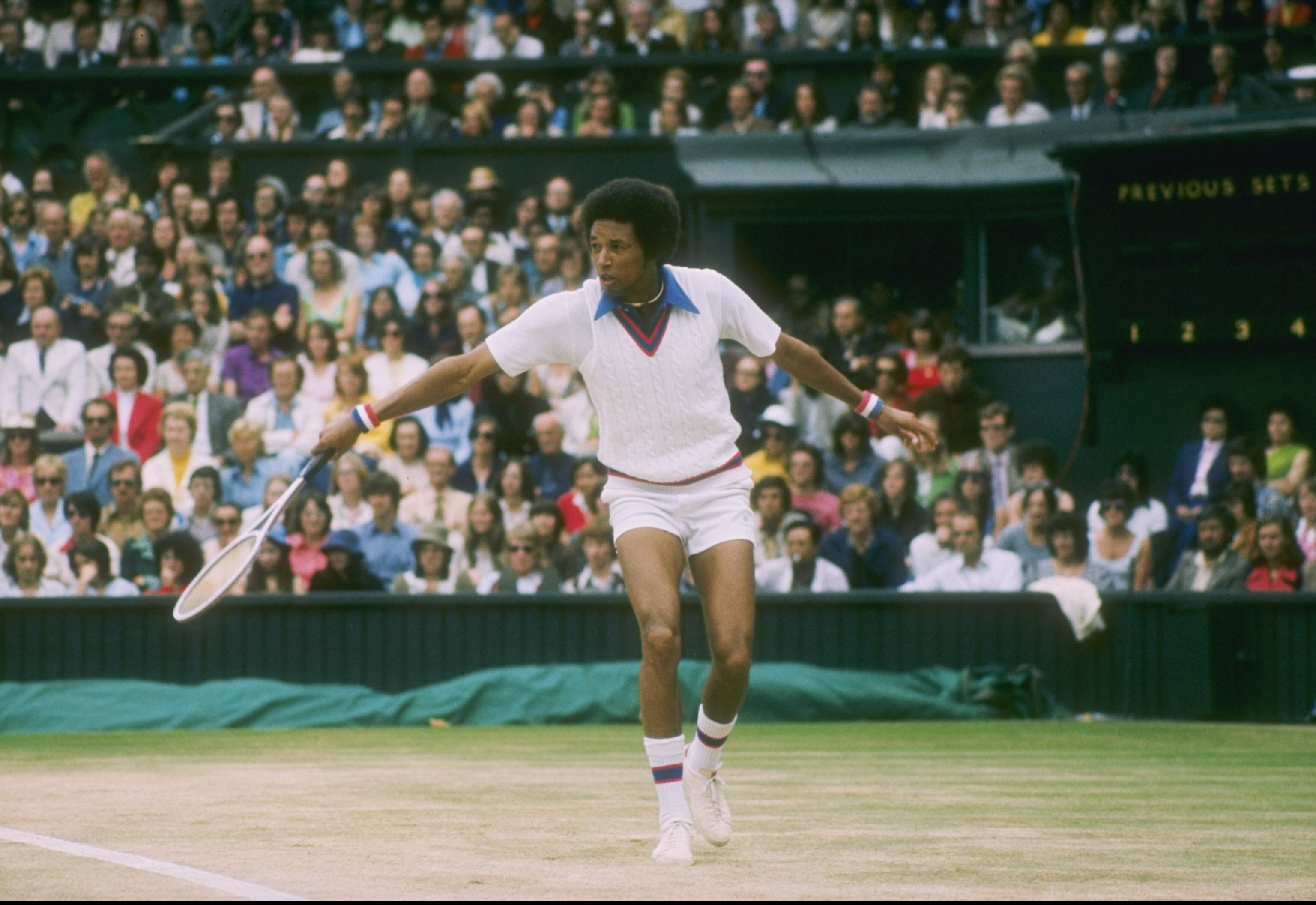 Arthur Ashe runs for the ball during a match at Wimbledon in England.