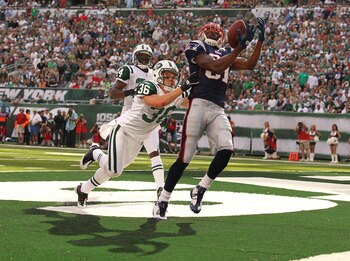 EAST RUTHERFORD, NJ - SEPTEMBER 19:  Jim Leonhard #36 of the New York Jets defends against Randy Moss #81 of the New England Patriots on September 19, 2010 at the New Meadowlands Stadium  in East Rutherford, New Jersey. There was no touchdown on the play.