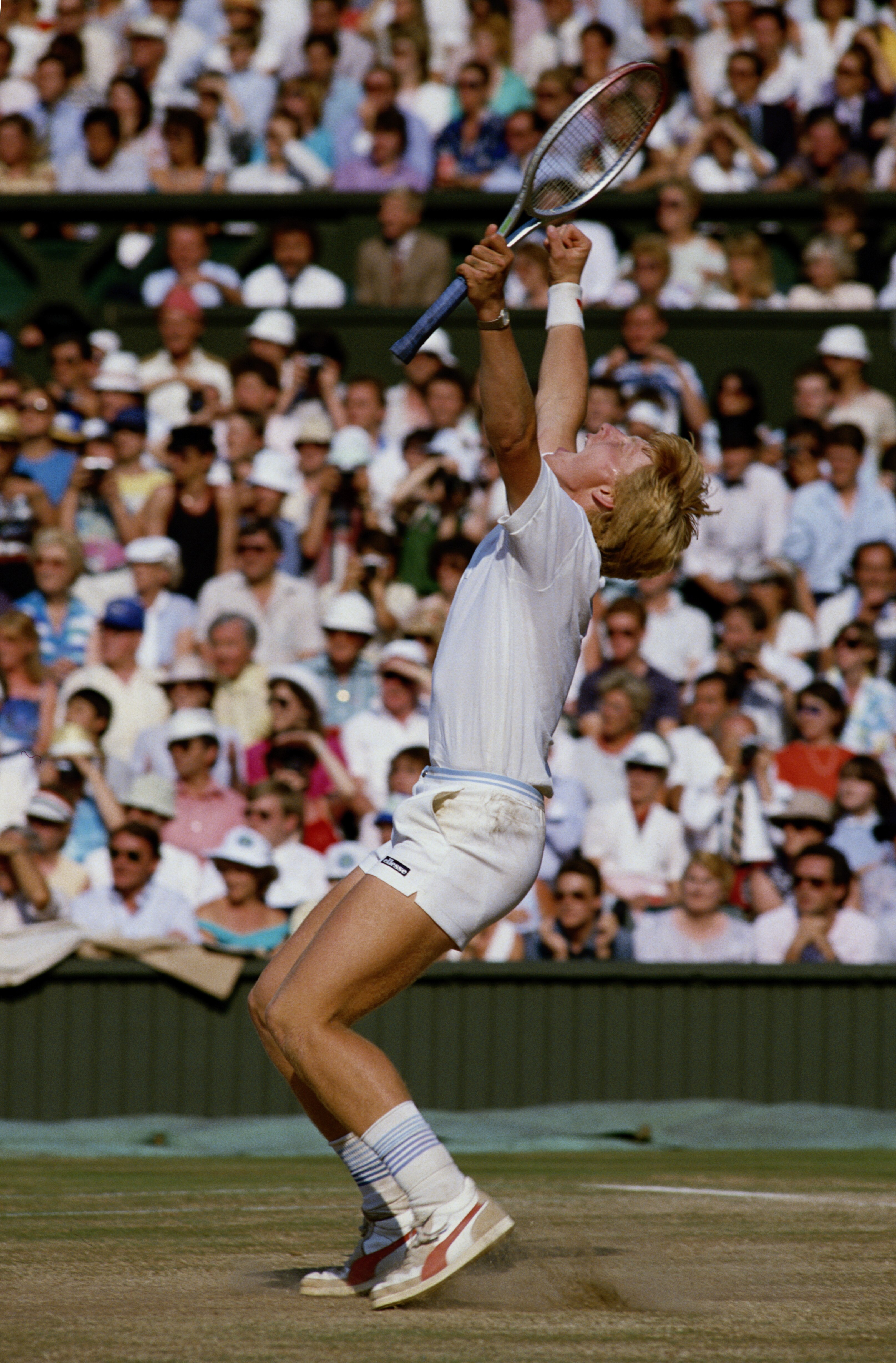 Boris Becker of Germany pumps his arms in the air to celebrate his defeat of Kevin Curren 6Â3, 6Â7 (4Â7), 7Â6 (7Â3), 6Â4 during the Men's Singles final of the Wimbledon Lawn Tennis Championship on 7th July 1985 at the All England Lawn Tennis and Croquet C