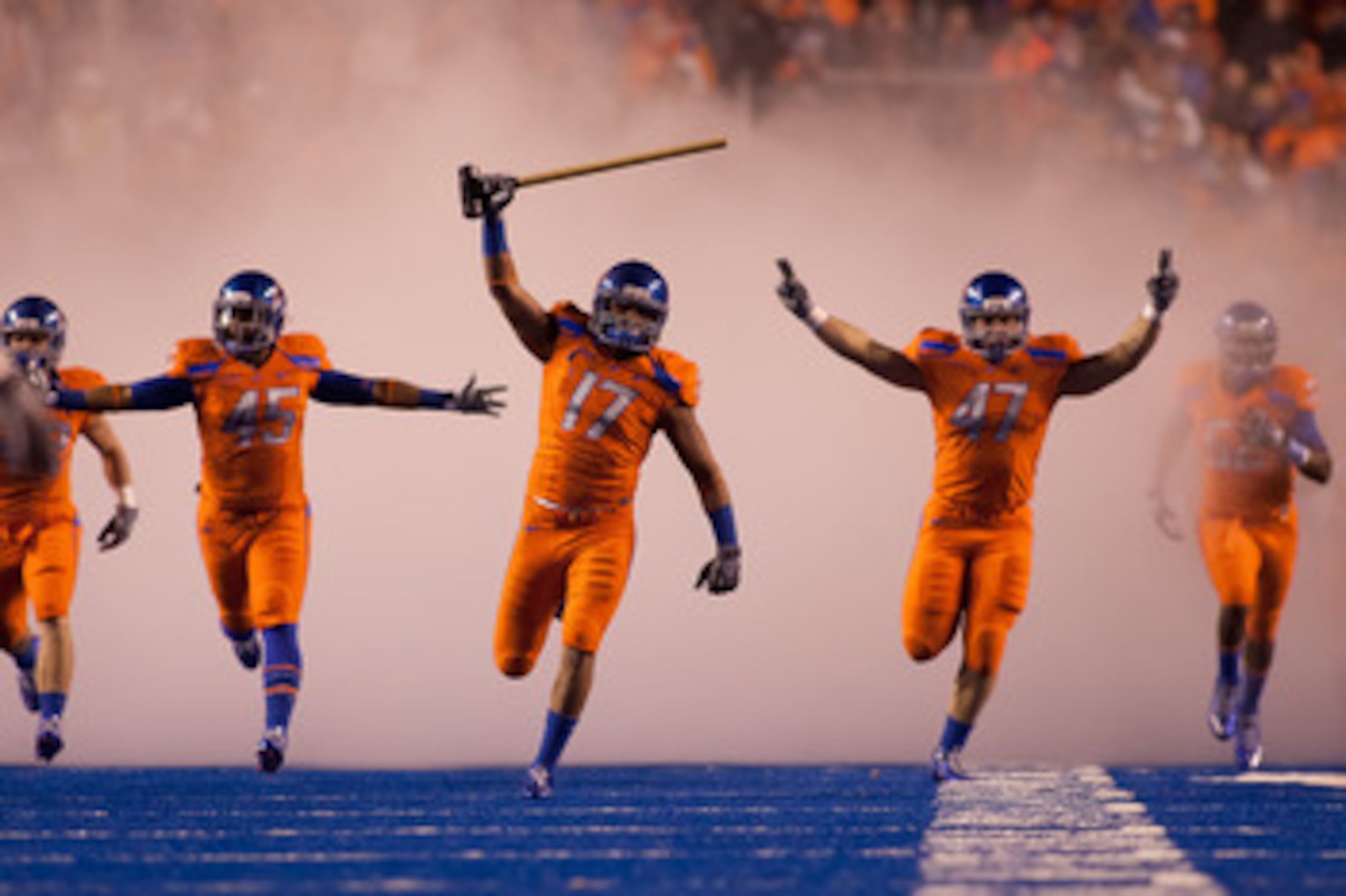 BOISE, ID - NOVEMBER 19:  Winston Venable #17 leads the Boise State Broncos onto the field before their game against the Fresno State Bulldogs at Bronco Stadium on November 19, 2010 in Boise, Idaho.  (Photo by Otto Kitsinger III/Getty Images)