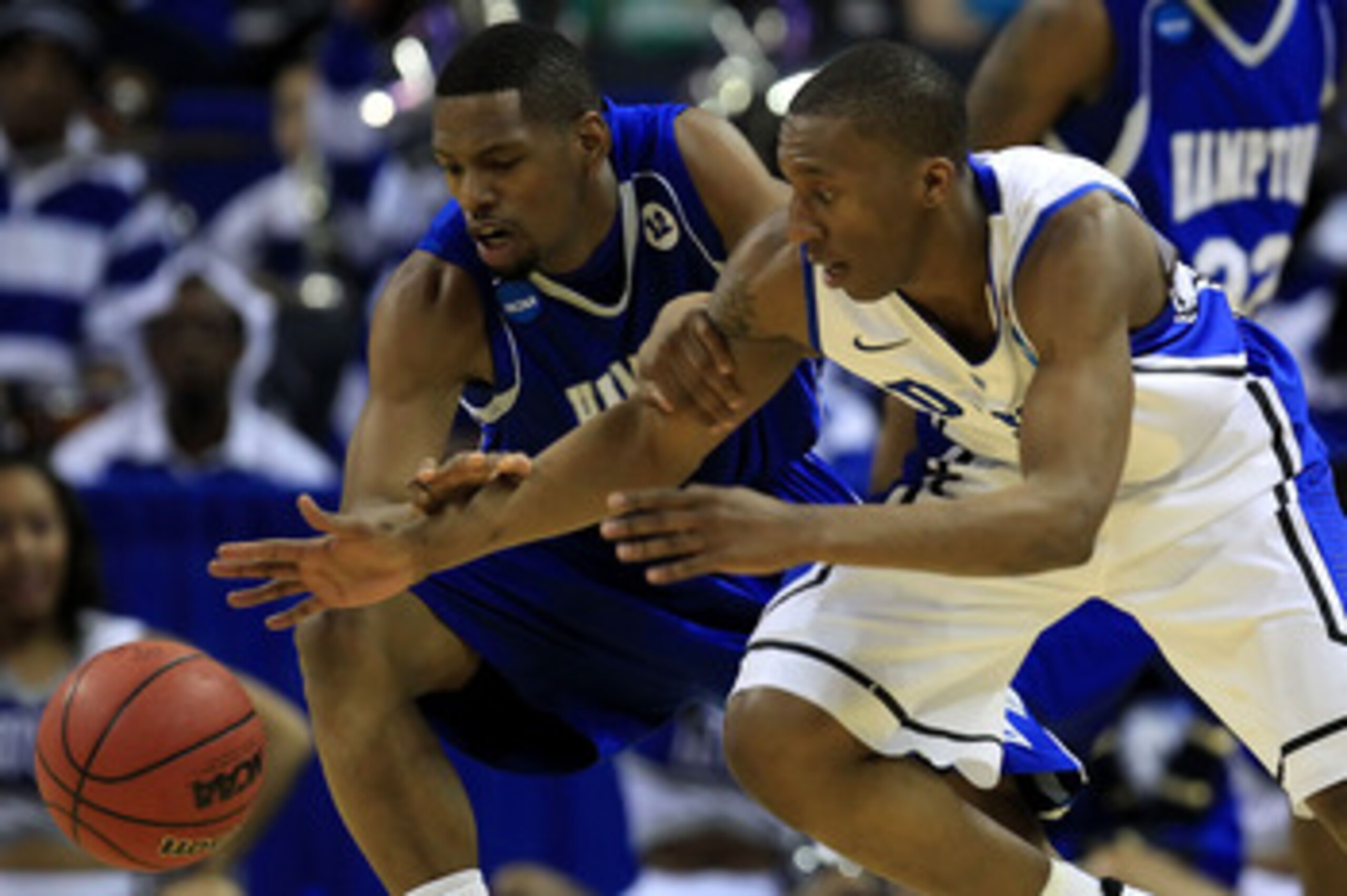 CHARLOTTE, NC - MARCH 18:  Nolan Smith #2 of the Duke Blue Devils and Brandon Tunnell #5 of the Hampton Pirates battle for the ball in the first half during the second round of the 2011 NCAA men's basketball tournament at Time Warner Cable Arena on March 
