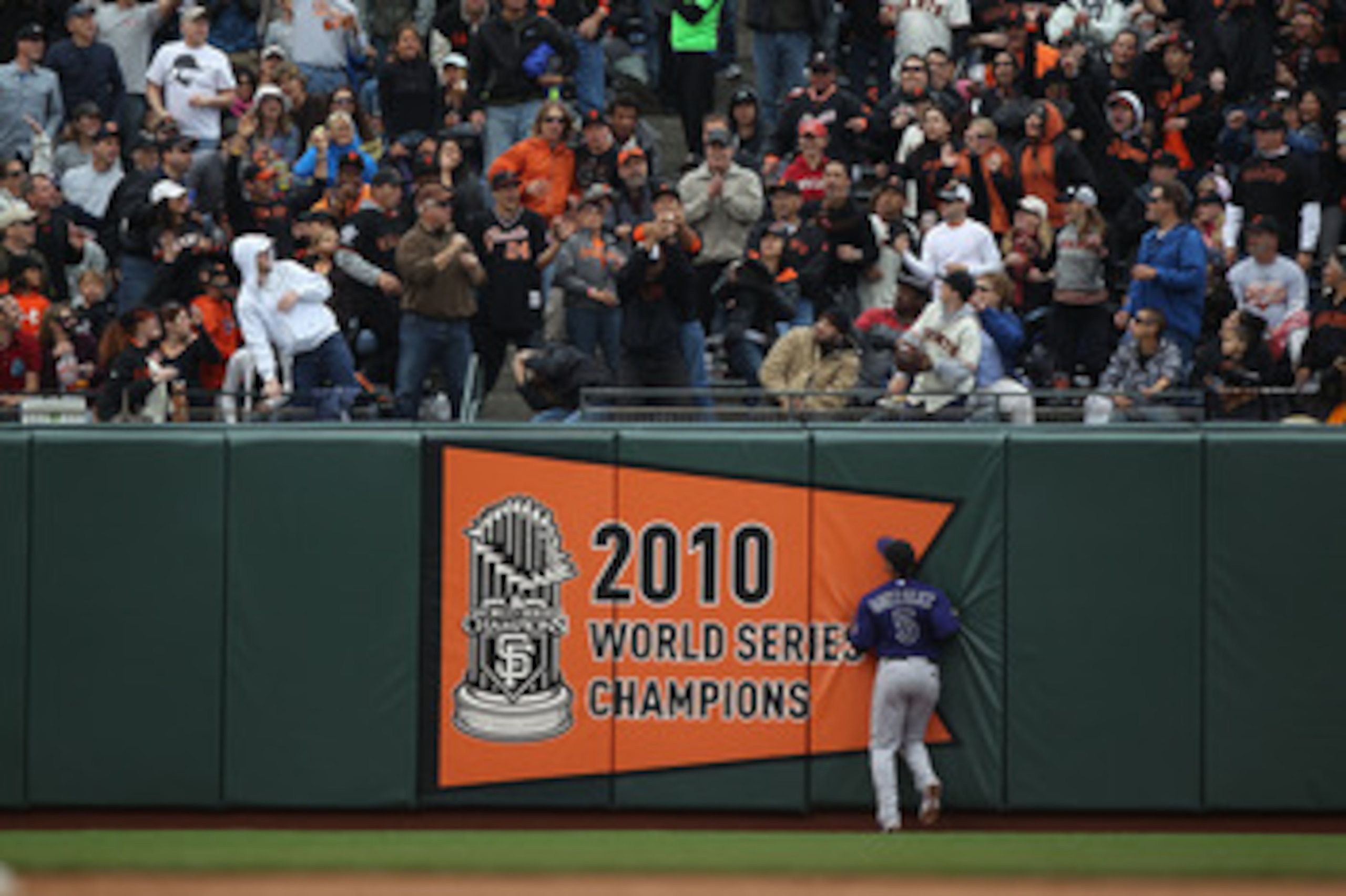 SAN FRANCISCO, CA - JUNE 04:  Carlos Gonzalez #5 of the Colorado Rockies watches a home run by Cody Ross in the sixth inning against the San Francisco Giants during an MLB game at AT&T Park on June 4, 2011 in San Francisco, California.  (Photo by Jed Jaco
