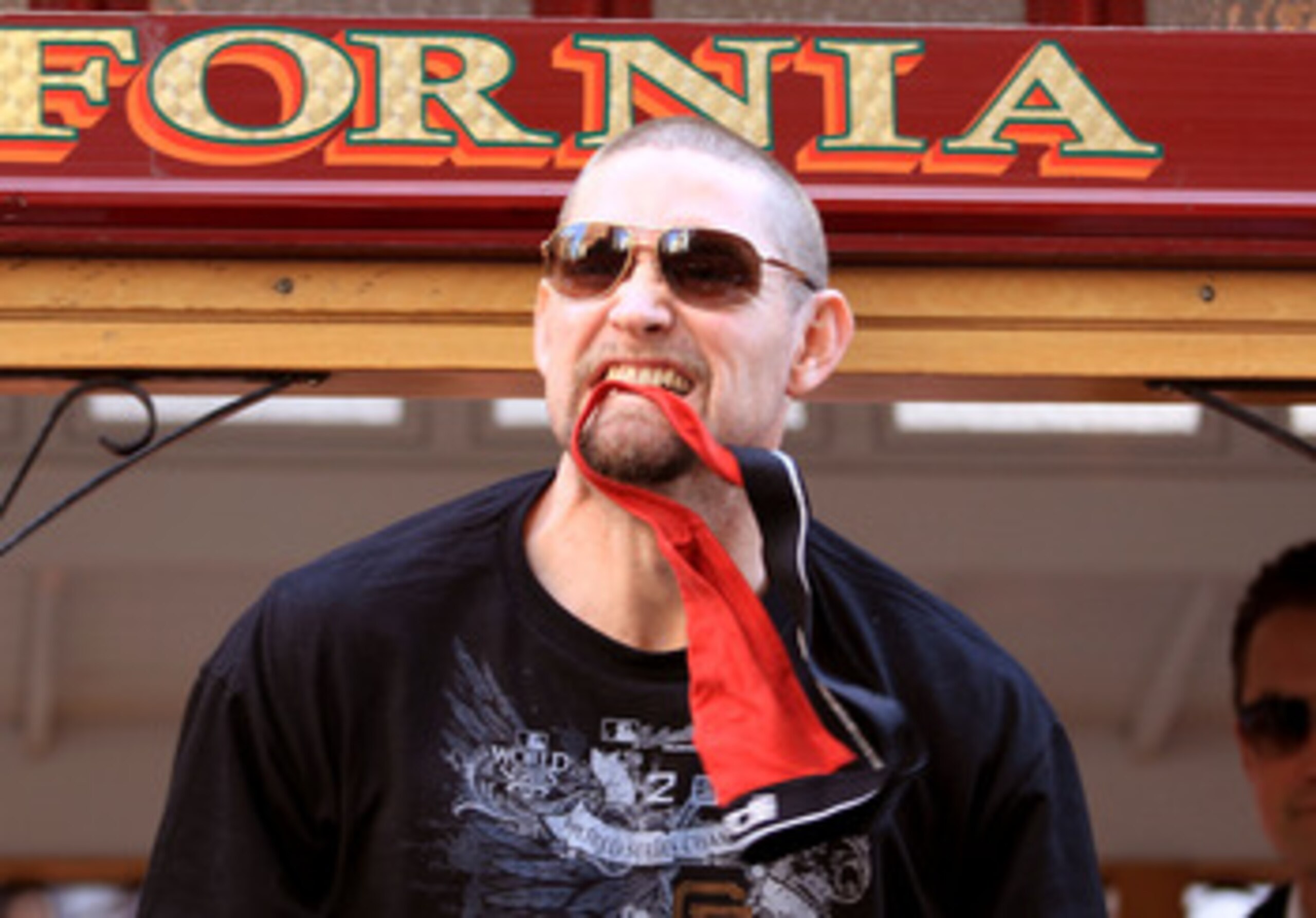SAN FRANCISCO - NOVEMBER 03:  Aubrey Huff of the San Francisco Giants bites his red rally thong during the San Francisco Giants victory parade on November 3, 2010 in San Francisco, California.  (Photo by Ezra Shaw/Getty Images)