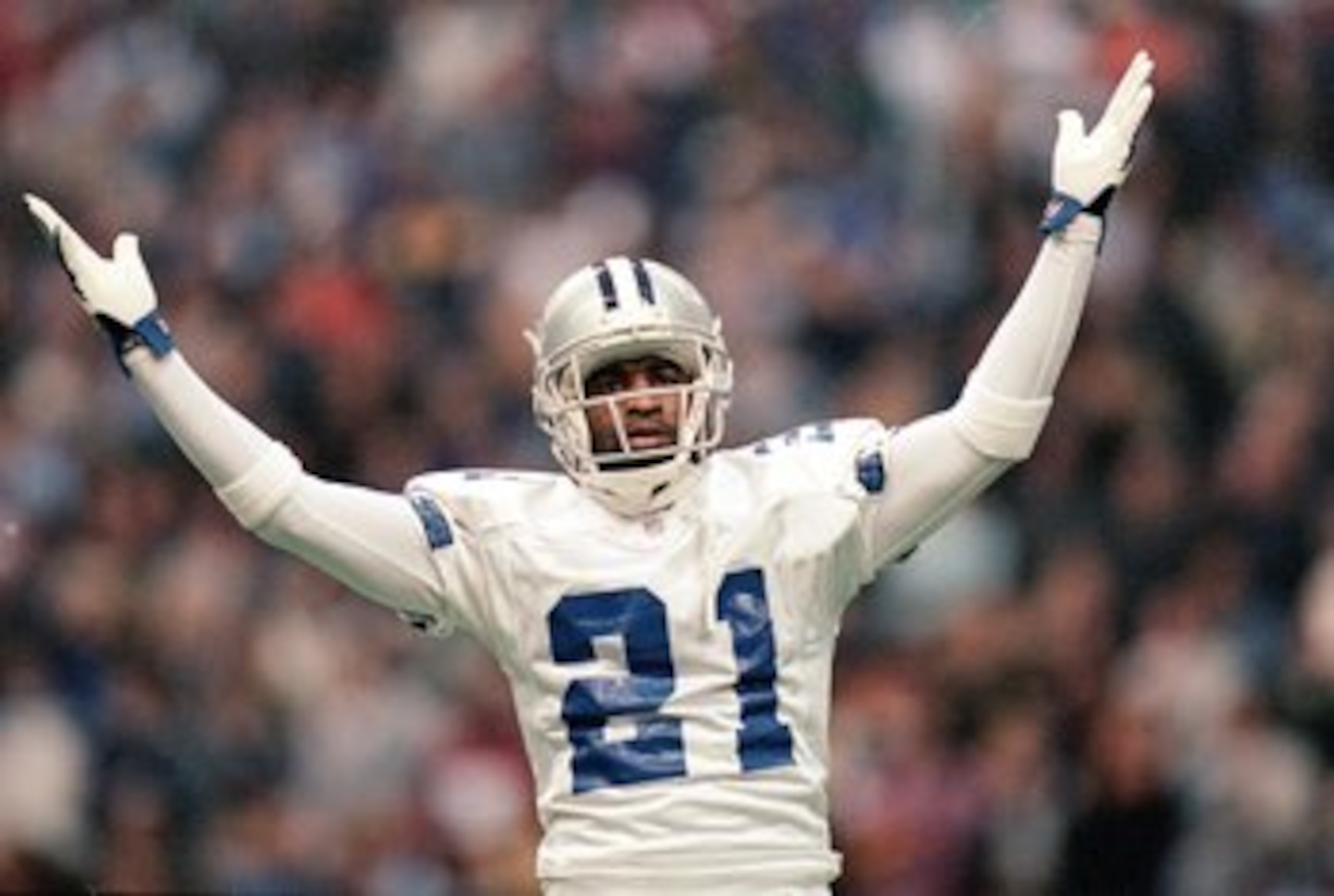25 Nov 1999: Deion Sanders #21 of the Dallas Cowboys celebrates on the field during the game against the Miami Dolphins at the Texas Stadium in Irving, Texas. The Cowboys defeated the Dolphins 20-3. Mandatory Credit: Ronald Martinez  /Allsport