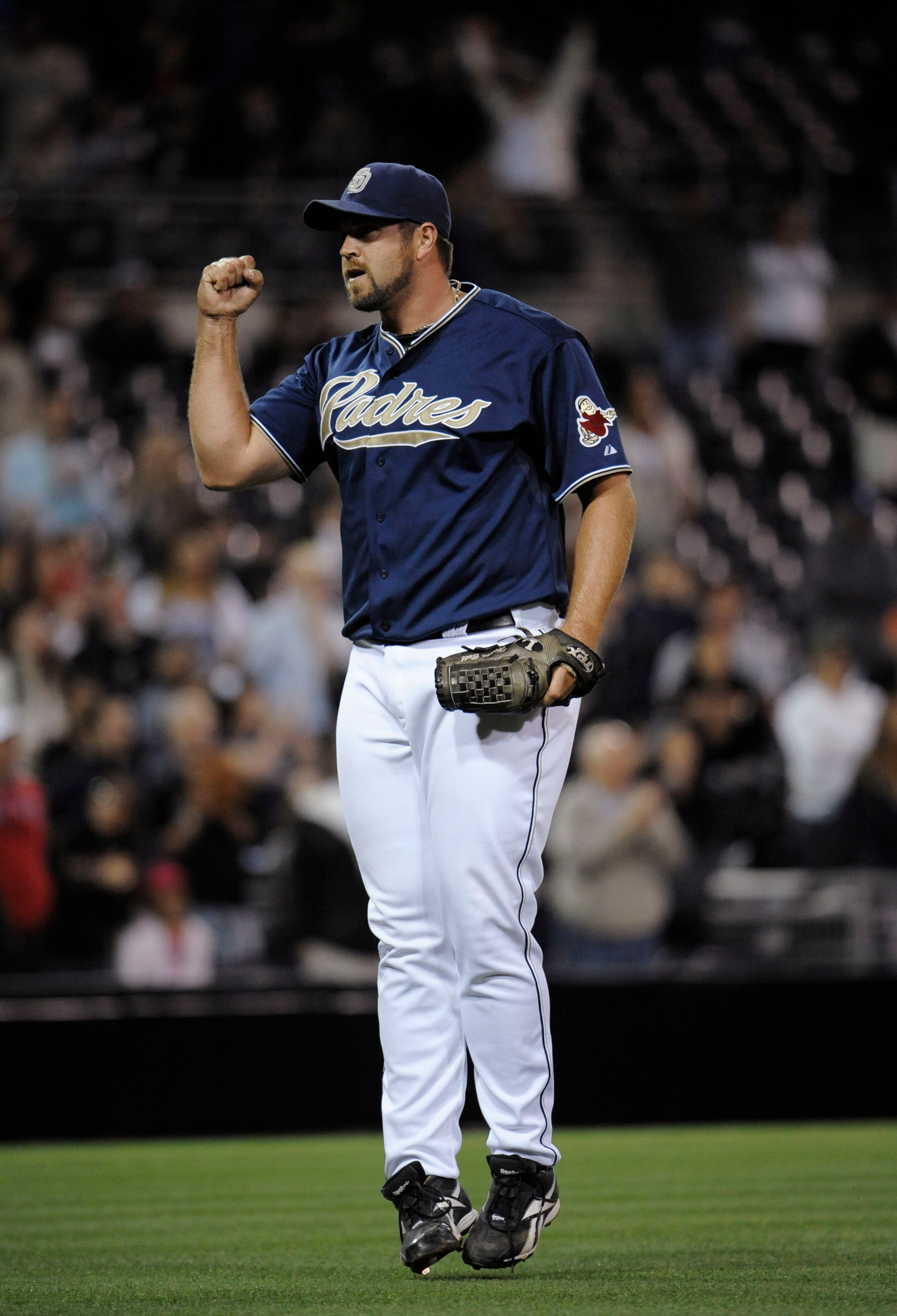 SAN DIEGO, CA - JUNE 4: Heath Bell #21 of the San Diego Padres pumps his fist after getting the last out in the ninth inning of a baseball game against the Houston Astros at Petco Park on June 4, 2011 in San Diego, California. The Padres won 6-3.  (Photo