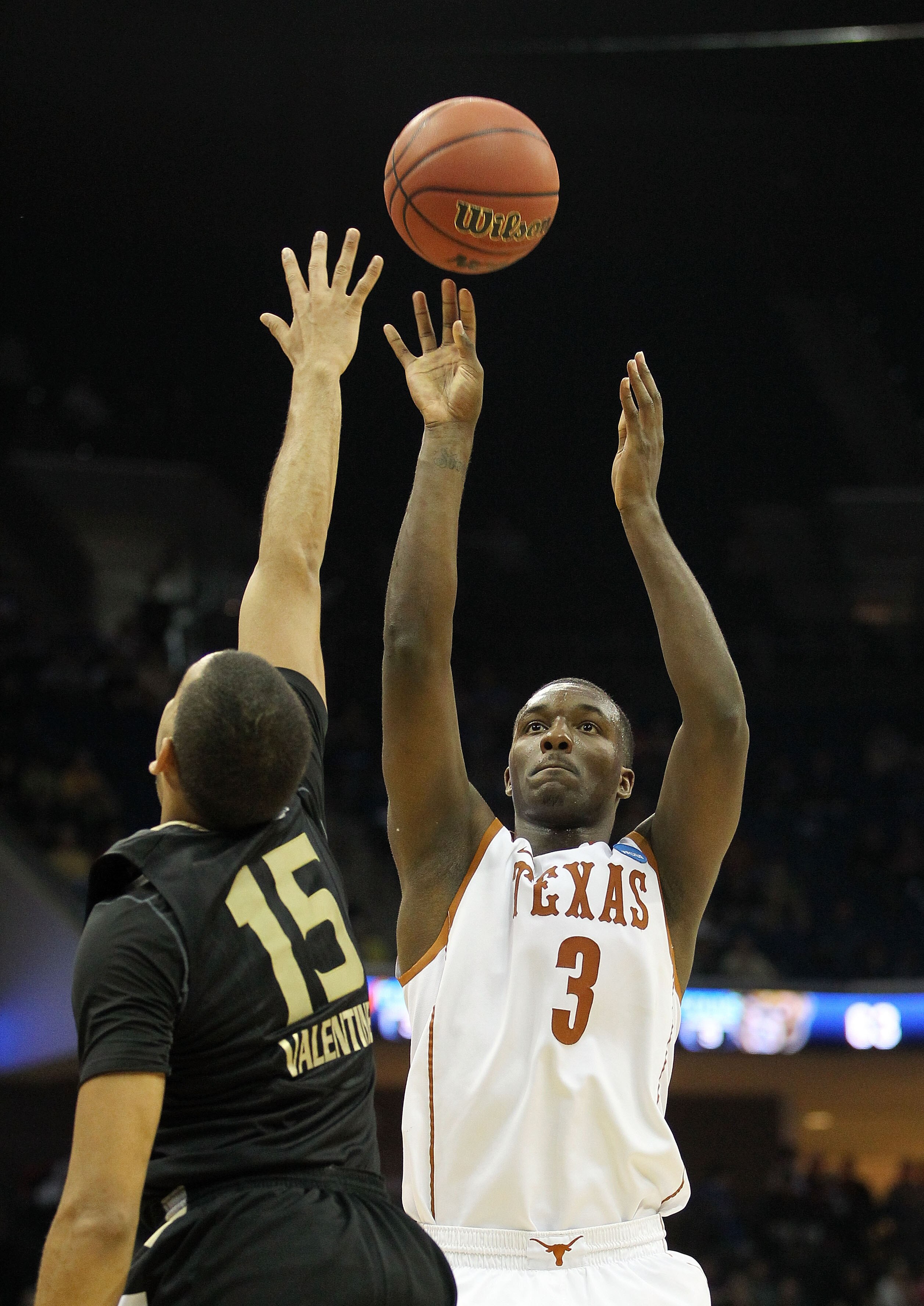 TULSA, OK - MARCH 18:  Jordan Hamilton #3 of the Texas Longhorns takes a shot as Drew Valentine #15 of the Oakland Golden Grizzlies defends during the second round of the 2011 NCAA men's basketball tournament at BOK Center on March 18, 2011 in Tulsa, Okla