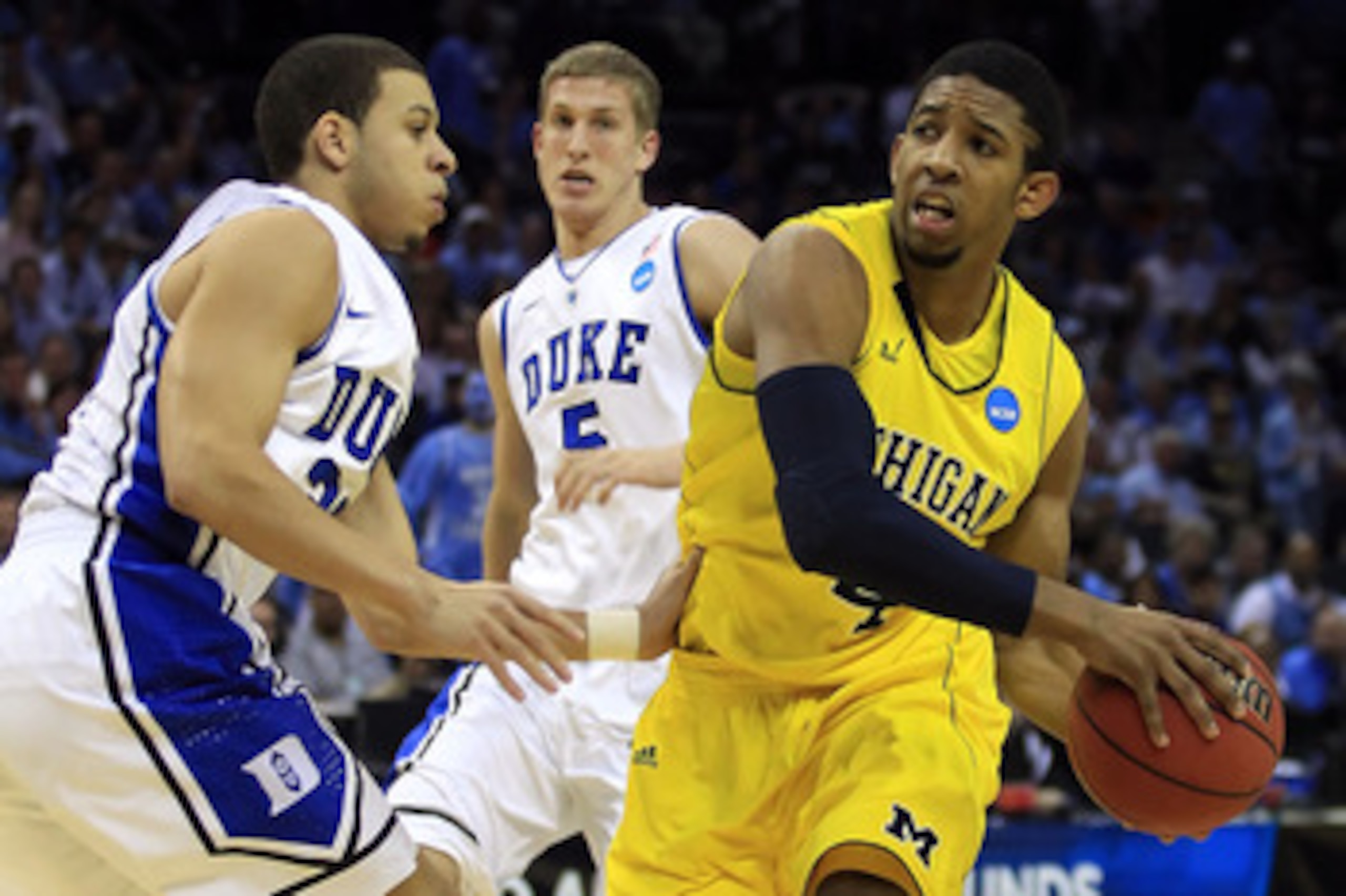 CHARLOTTE, NC - MARCH 20: Darius Morris #4 of the Michigan Wolverines drives on Seth Curry #30 of the Duke Blue Devils in the first half during the third round of the 2011 NCAA men's basketball tournament at Time Warner Cable Arena on March 20, 2011 in Ch