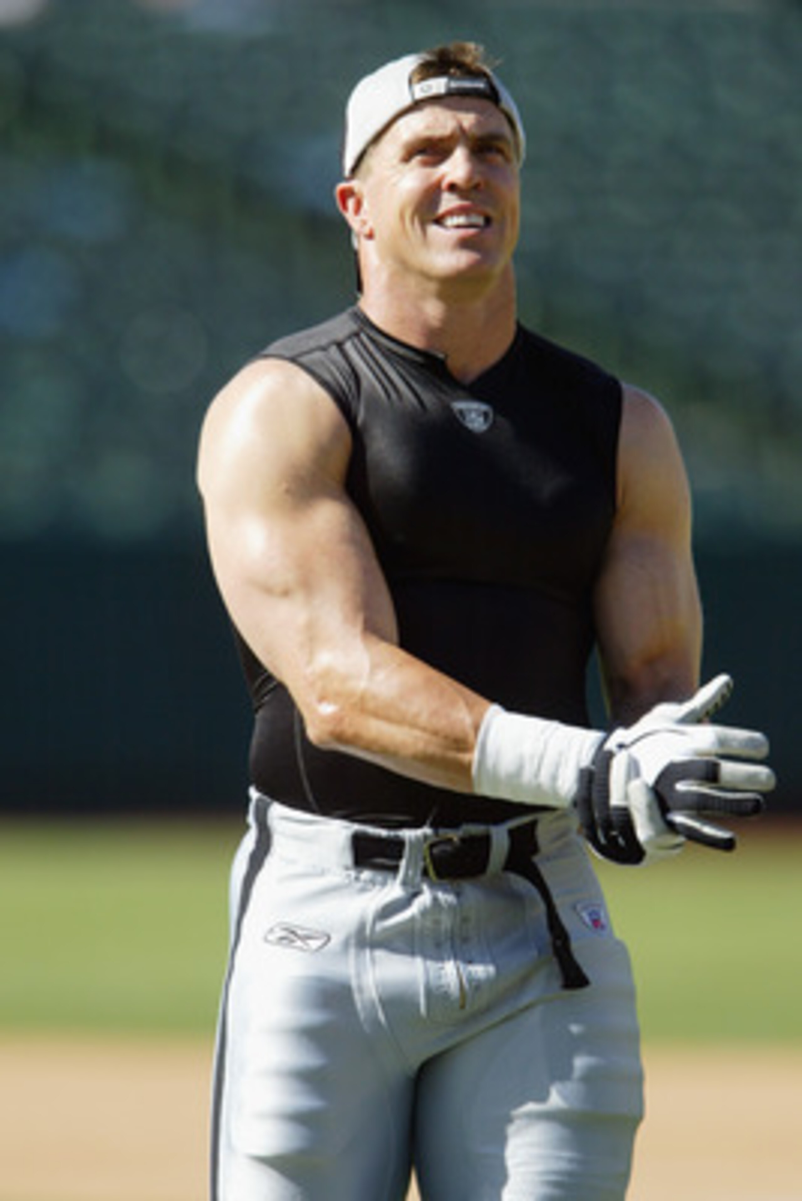 OAKLAND, CA - AUGUST 22 :  Bill Romanowski #53 of the Oakland Raiders warms up before the game against the Minnesota Vikings on August 22, 2003 at the Network Associates Coliseum in Oakland, California.  The Vikings defeated the Raiders 21-6.  (Photo by J