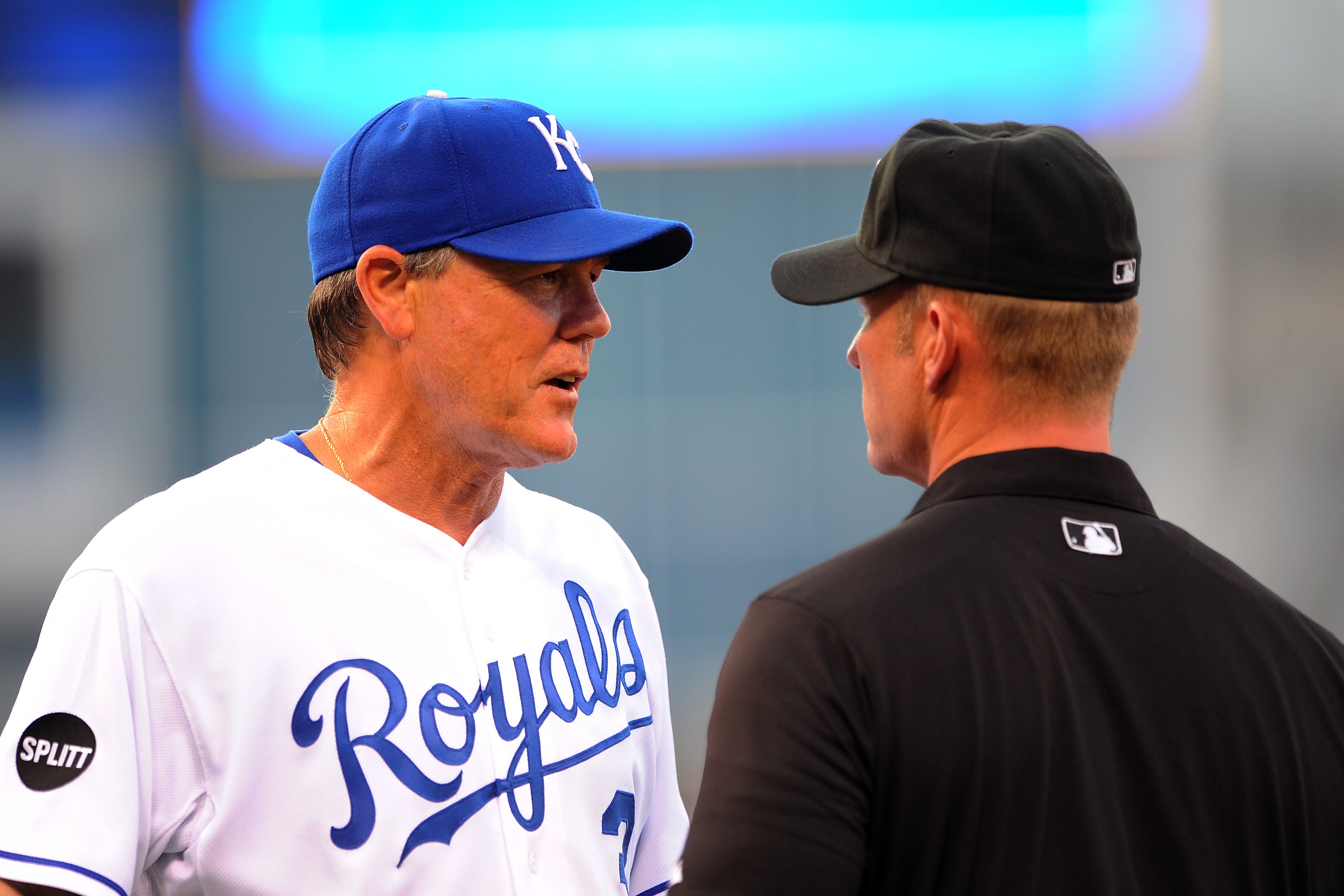 KANSAS CITY, MO - JUNE 6:  Manager Ned Yost #3 of the Kansas City Royals discusses a ruling with first base umpire Jim Wolf #28 after  Yunel Escobar of the Toronto Blue Jays was ruled safe at first base at Kauffman Stadium on June 6, 2011 in Kansas City,