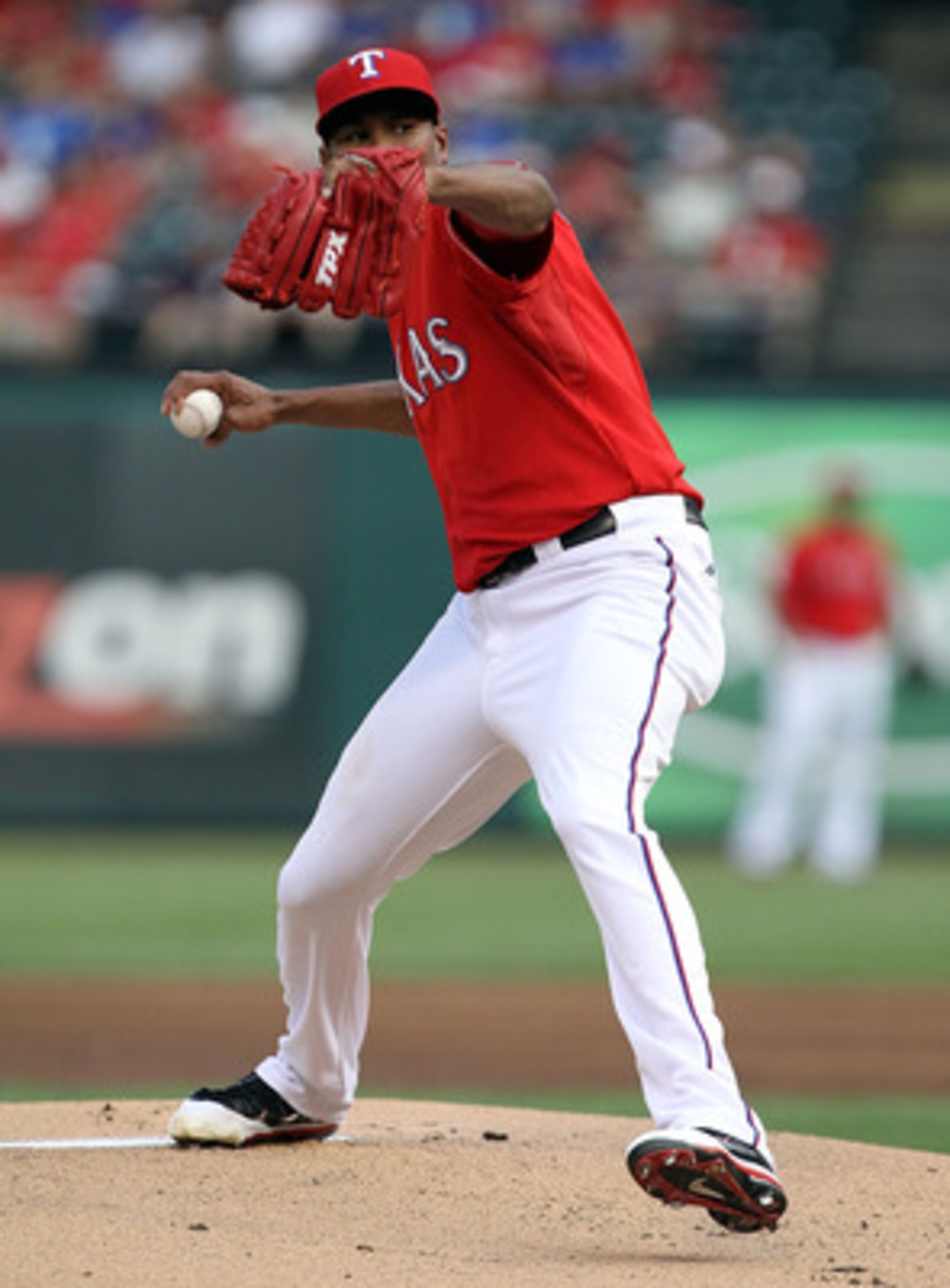 ARLINGTON, TX - JUNE 08:  Pitcher Alexi Ogando #41 of the Texas Rangers throws against the Detroit Tigers at Rangers Ballpark in Arlington on June 8, 2011 in Arlington, Texas.  (Photo by Ronald Martinez/Getty Images)