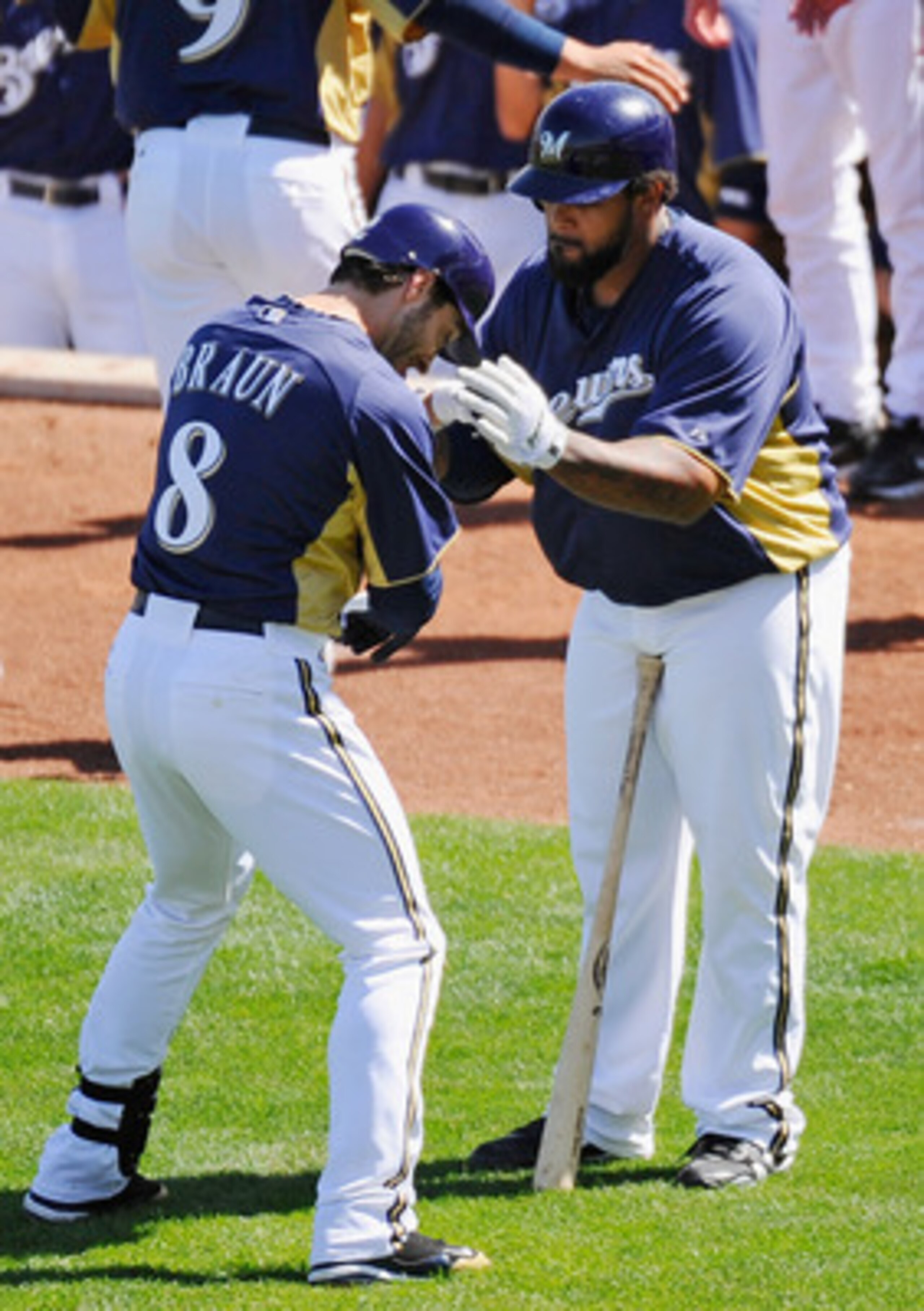 PHOENIX, AZ - MARCH 10: Ryan Braun #8 of the Milwaukee Brewers is congratulated by teammate Prince Fielder#28 after hitting a three run home run against the Colorado Rockies in the third inning of the spring training baseball game at Maryvale Baseball Pa PHOENIX, AZ - MARCH 10: Ryan Braun #8 of the Milwaukee Brewers is congratulated by teammate Prince Fielder#28 after hitting a three run home run against the Colorado Rockies in the third inning of the spring training baseball game at Maryvale Baseball Pa