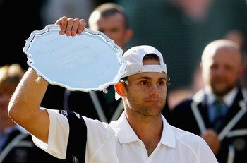 WIMBLEDON, ENGLAND - JULY 05:  Andy Roddick of USA looks despondent after defeat during the men's singles final match against Roger Federer of Switzerland on Day Thirteen of the Wimbledon Lawn Tennis Championships at the All England Lawn Tennis and Croque