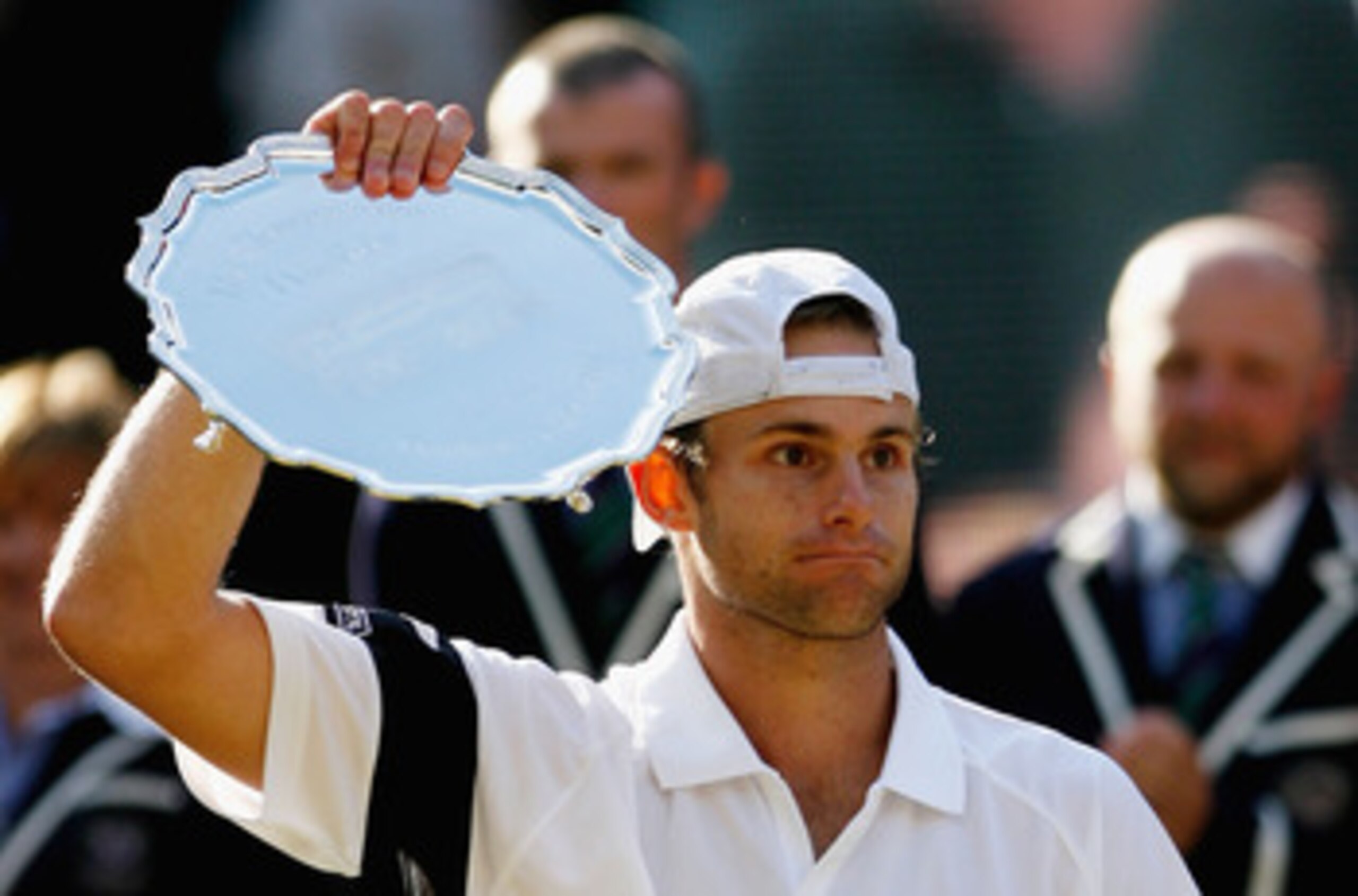 WIMBLEDON, ENGLAND - JULY 05:  Andy Roddick of USA looks despondent after defeat during the men's singles final match against Roger Federer of Switzerland on Day Thirteen of the Wimbledon Lawn Tennis Championships at the All England Lawn Tennis and Croque