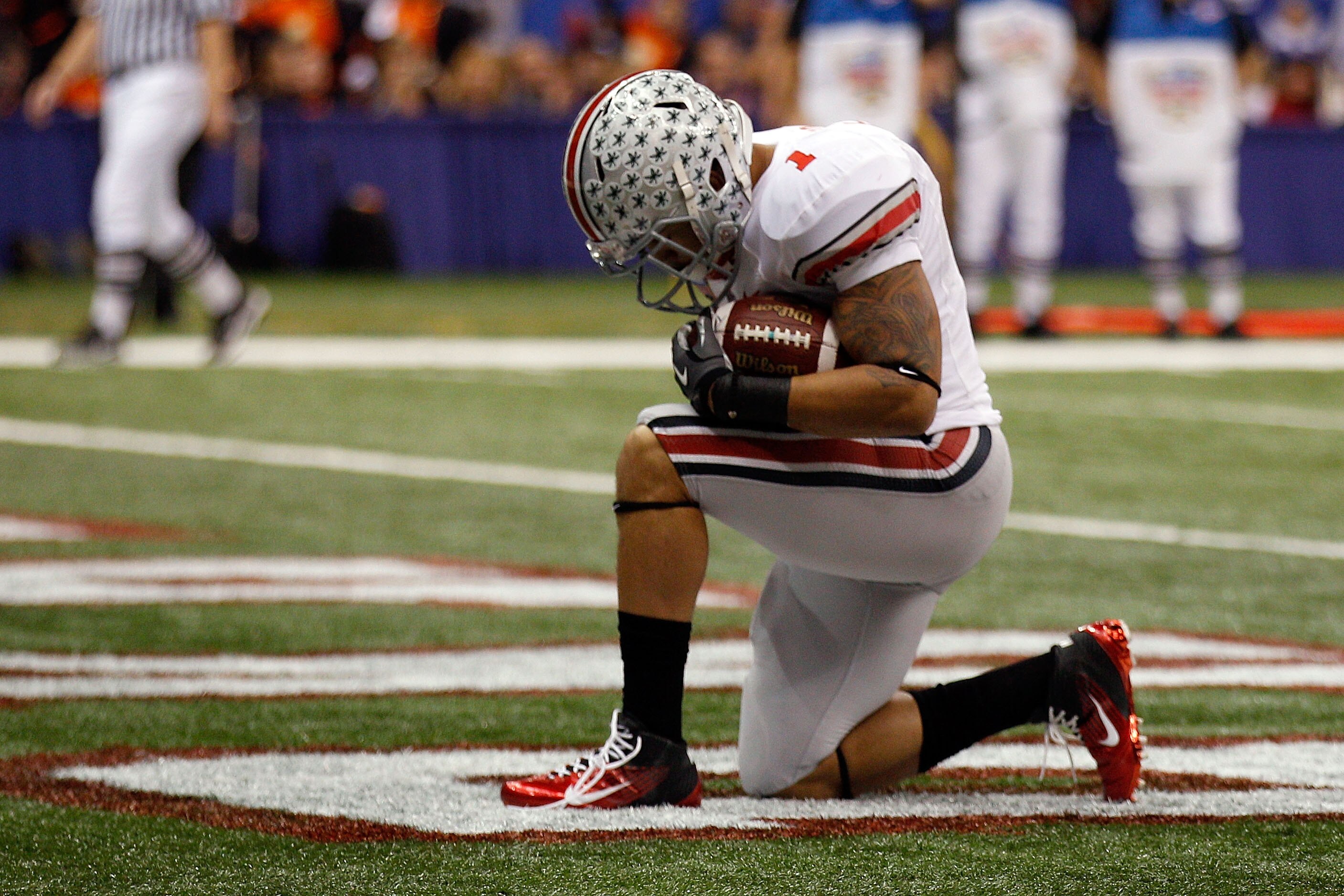 NEW ORLEANS, LA - JANUARY 04: Dan Herron #1 of the Ohio State Buckeyes reacts after he scores on a nine-yard touchdown run in the first half against the Arkansas Razorbacks during the Allstate Sugar Bowl at the Louisiana Superdome on January 4, 2011 in N NEW ORLEANS, LA - JANUARY 04: Dan Herron #1 of the Ohio State Buckeyes reacts after he scores on a nine-yard touchdown run in the first half against the Arkansas Razorbacks during the Allstate Sugar Bowl at the Louisiana Superdome on January 4, 2011 in N