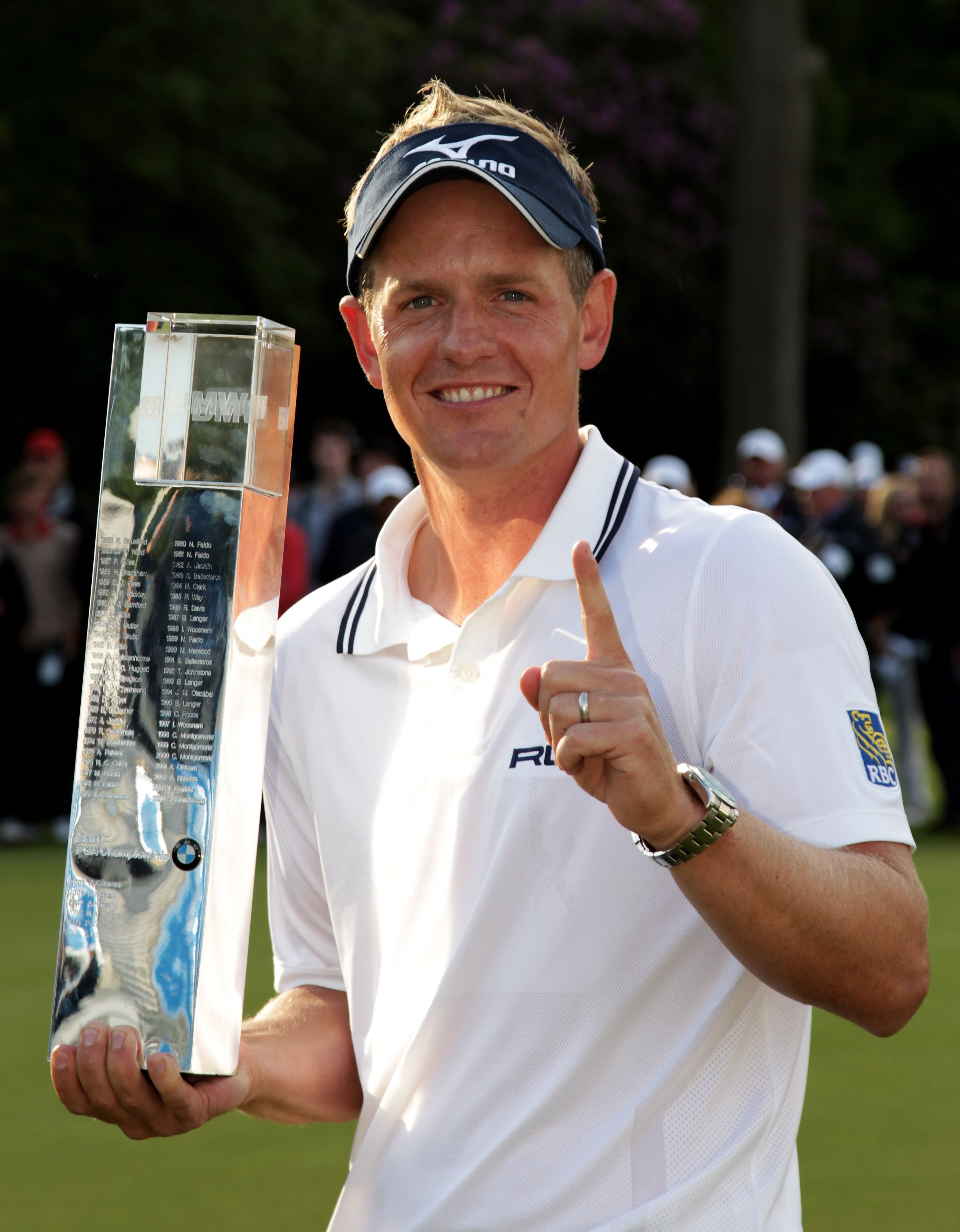VIRGINIA WATER, ENGLAND - MAY 29:  Luke Donald of England holds the trophy following his victory in a playoff on the 18th green, which also secured him the Number one World ranking during the final round of the BMW PGA Championship  at the Wentworth Club