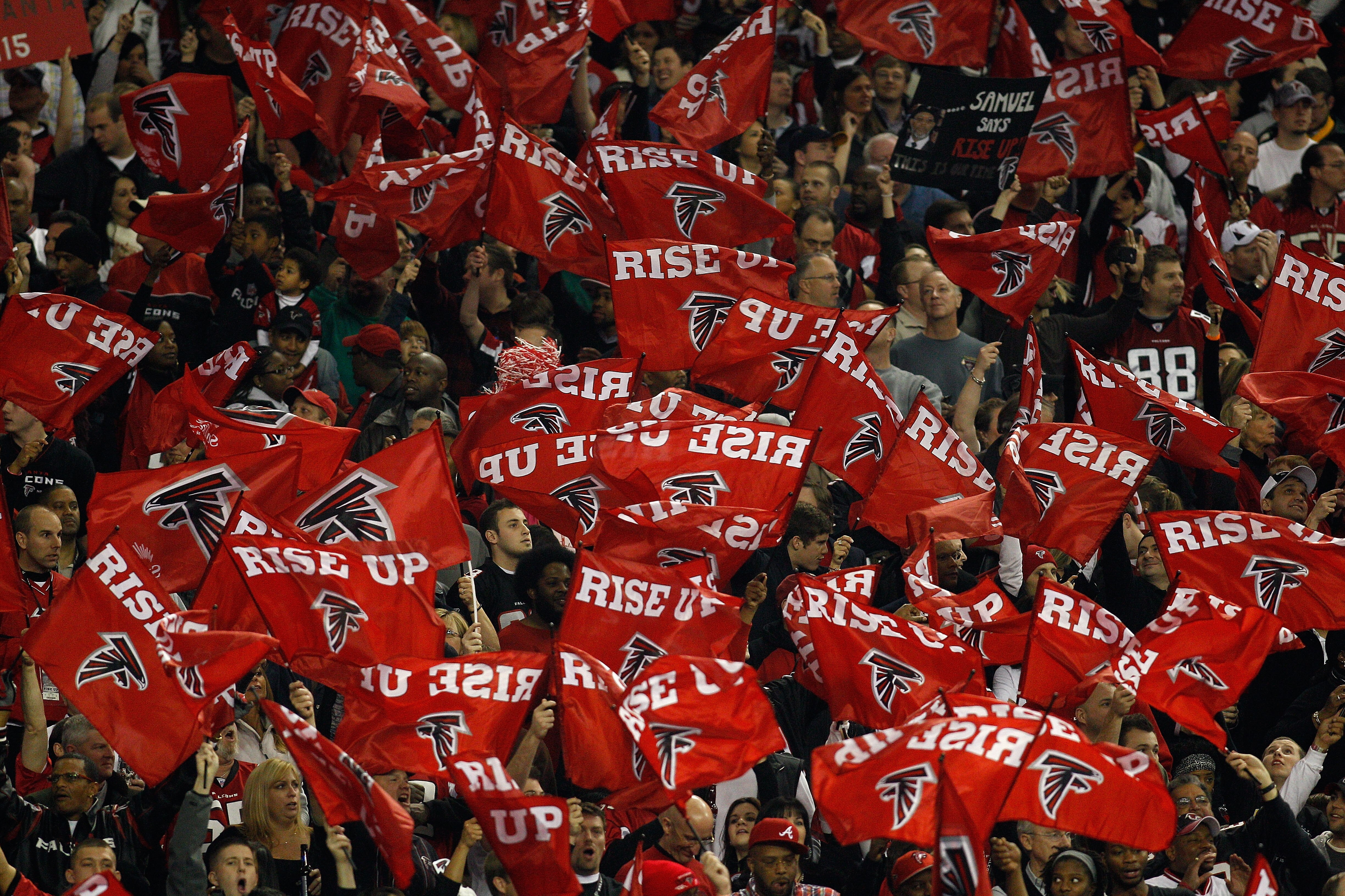 ATLANTA, GA - JANUARY 15:  Fans of the Atlanta Falcons wave flags which read 'Rise Up' against the Green Bay Packers during their 2011 NFC divisional playoff game at Georgia Dome on January 15, 2011 in Atlanta, Georgia.  (Photo by Chris Graythen/Getty Ima